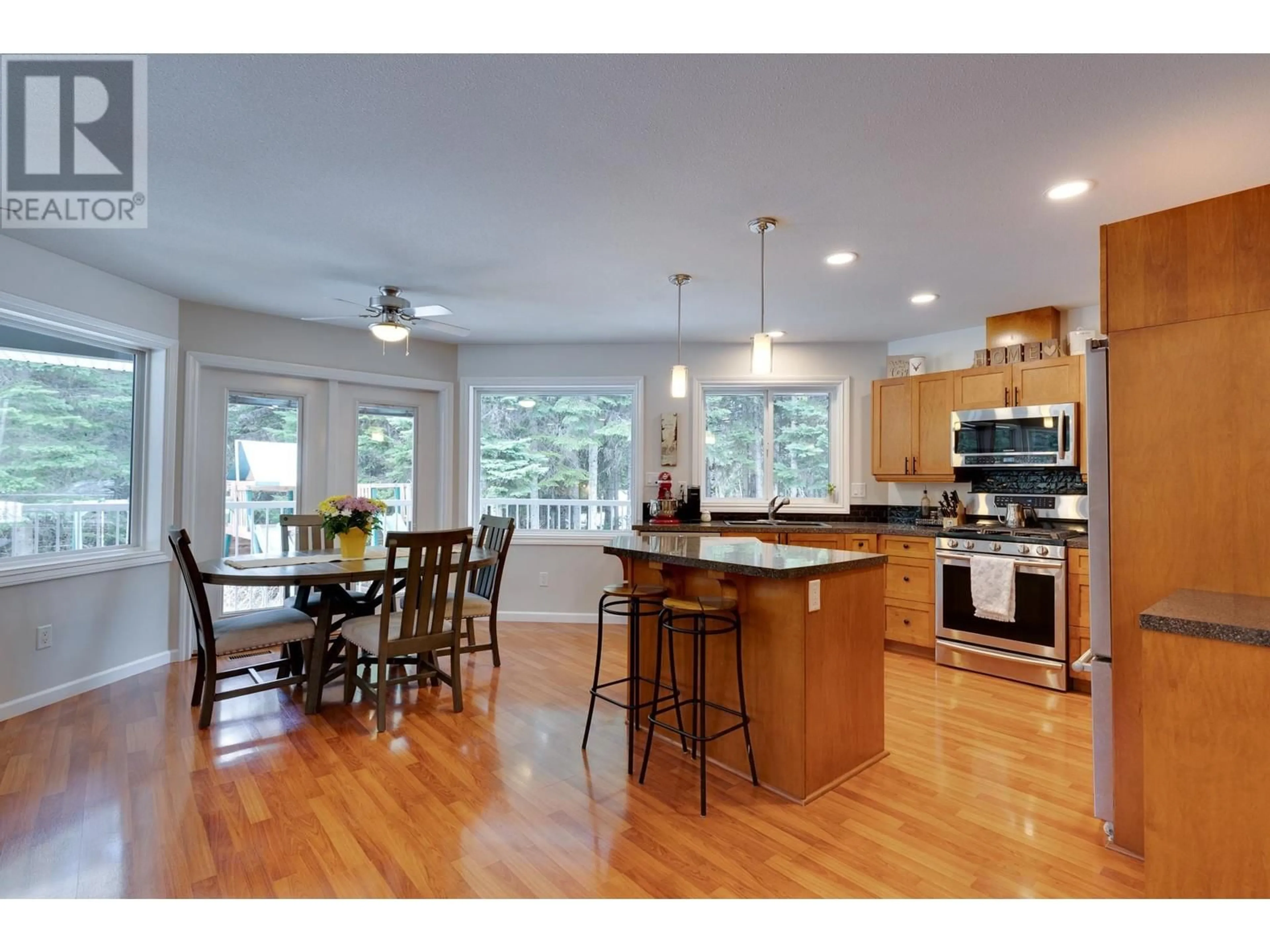 Open concept kitchen, wood/laminate floor for 9240 SYMS ROAD, Prince George British Columbia V2K5J2