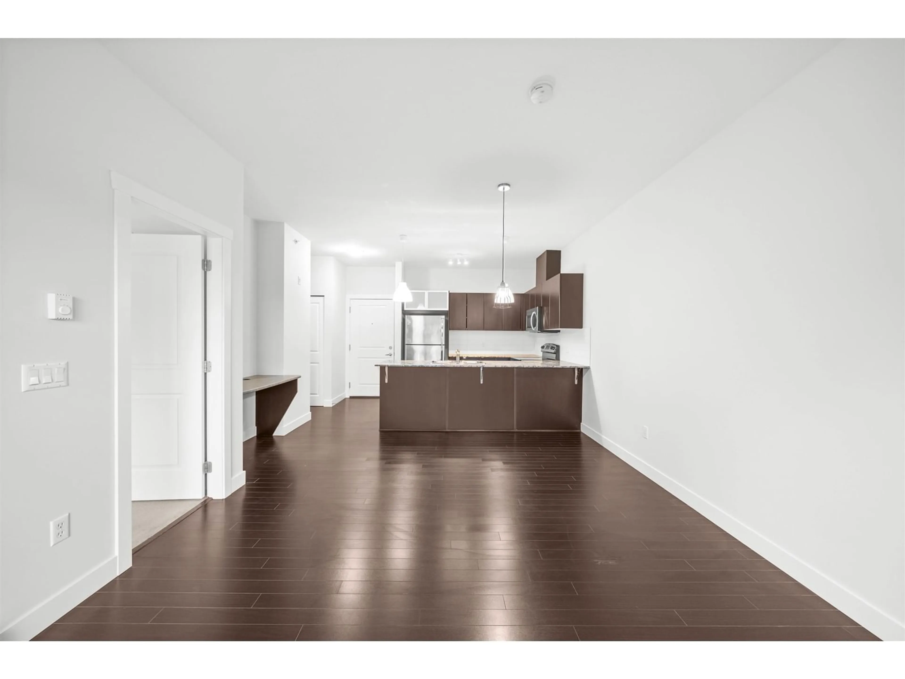 Open concept kitchen, wood/laminate floor for 405 - 9655 KING GEORGE, Surrey British Columbia V3T0C7