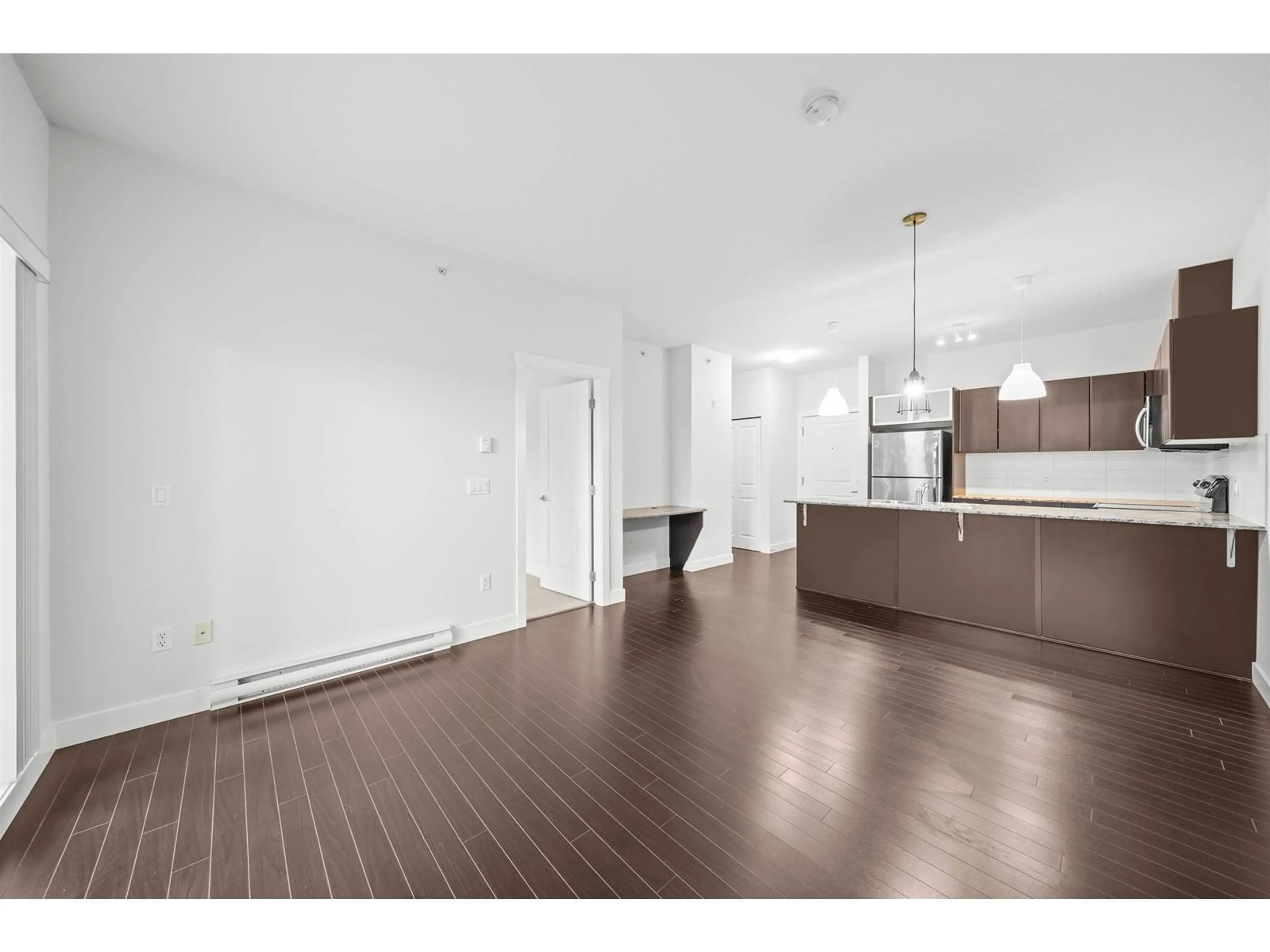 Open concept kitchen, wood/laminate floor for 405 - 9655 KING GEORGE, Surrey British Columbia V3T0C7