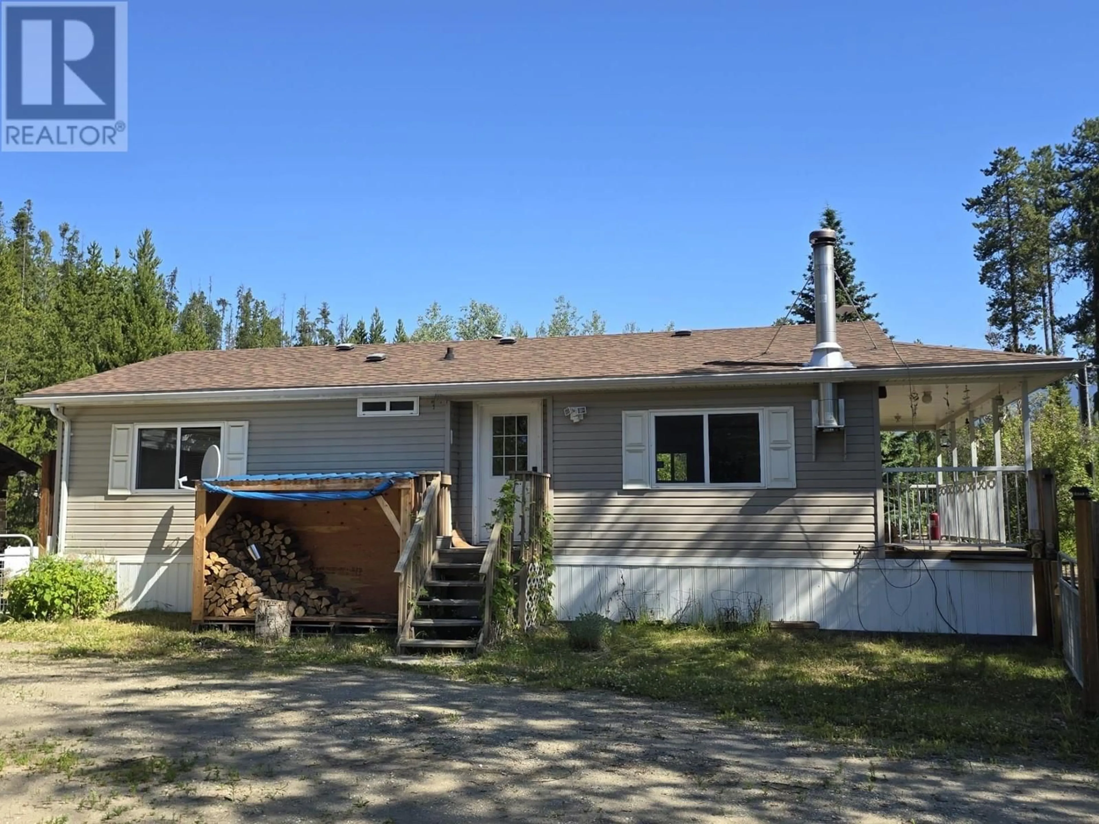 Home with vinyl exterior material, street for 5925 WHISKEYFILL ROAD, Valemount British Columbia V0E2Z0