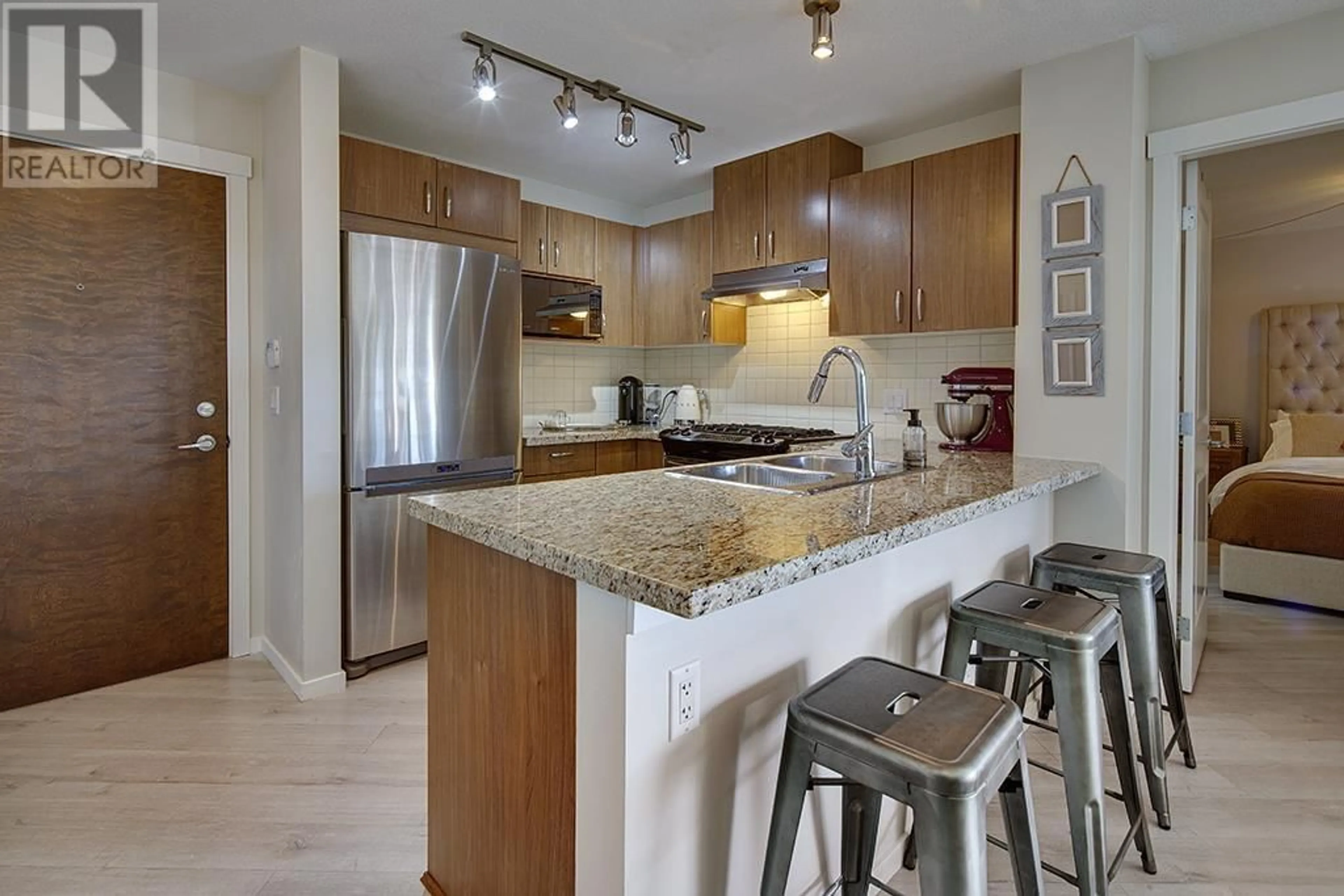 Open concept kitchen, unknown for 207 - 3110 DAYANEE SPRINGS BOULEVARD, Coquitlam British Columbia V3E0B4