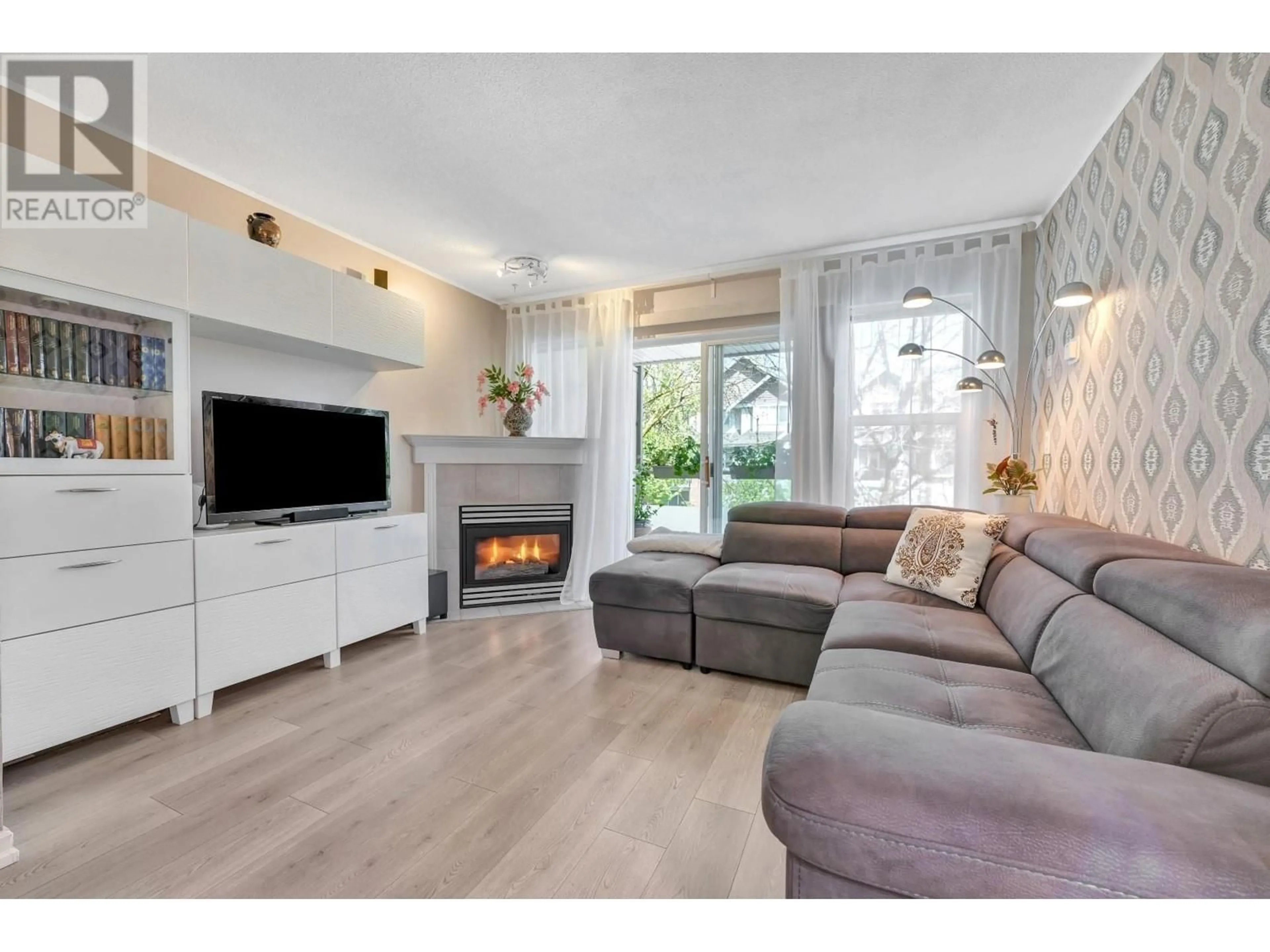 Living room with furniture, wood/laminate floor for 202 - 1558 GRANT AVENUE, Port Coquitlam British Columbia V3B1P2
