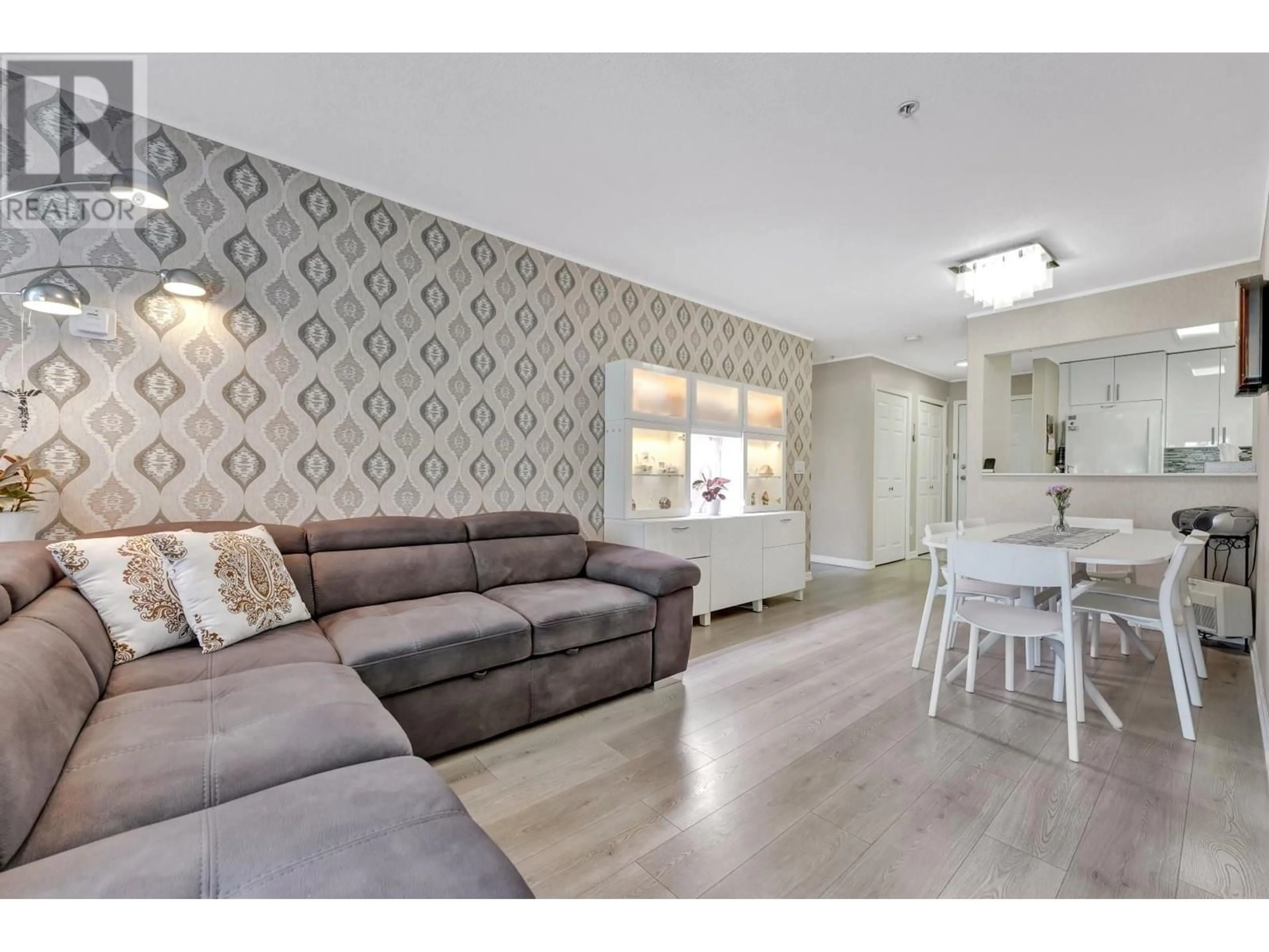Living room with furniture, wood/laminate floor for 202 - 1558 GRANT AVENUE, Port Coquitlam British Columbia V3B1P2