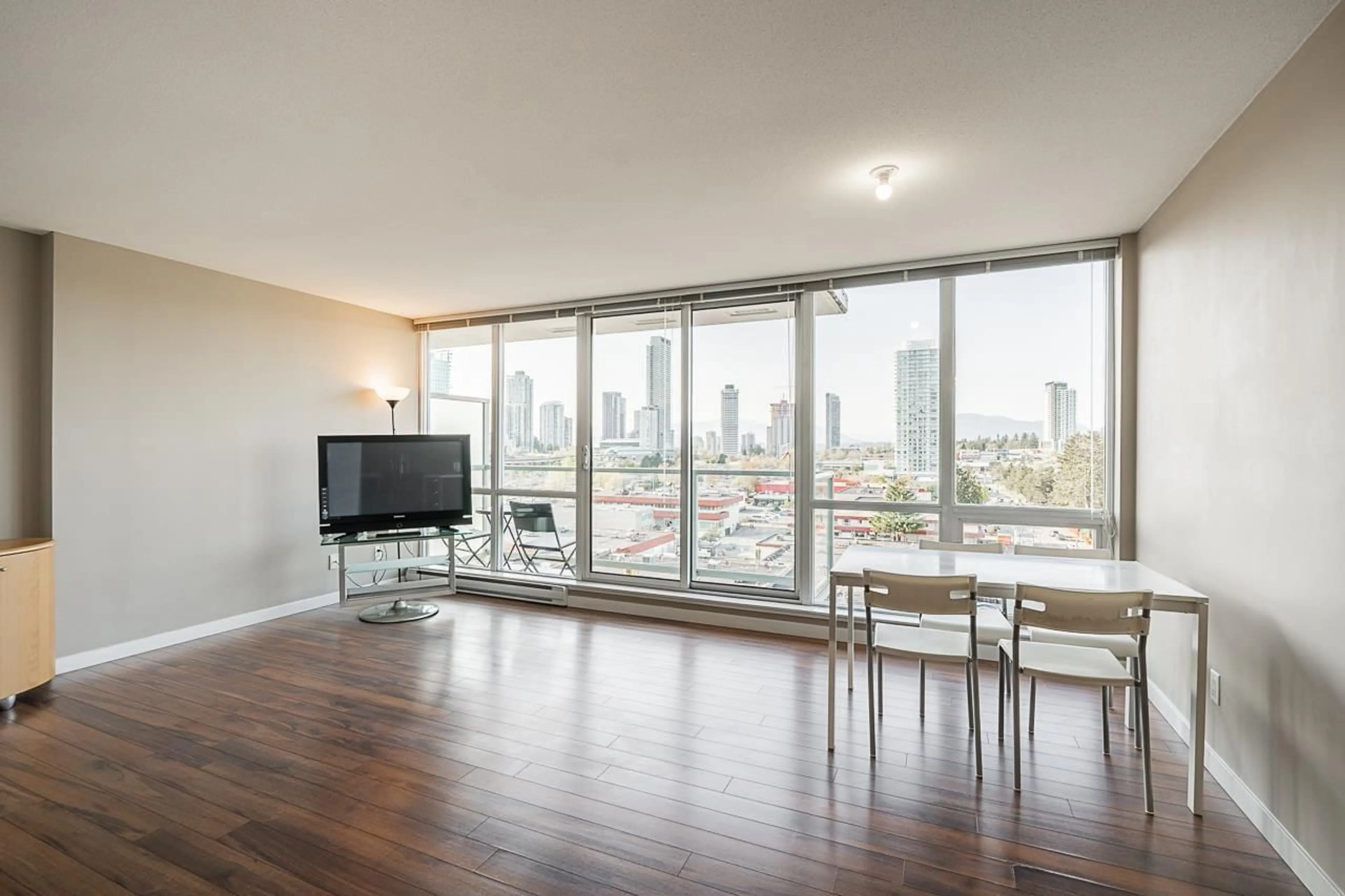 Living room with furniture, wood/laminate floor for 806 - 13688 100, Surrey British Columbia V3T0G5