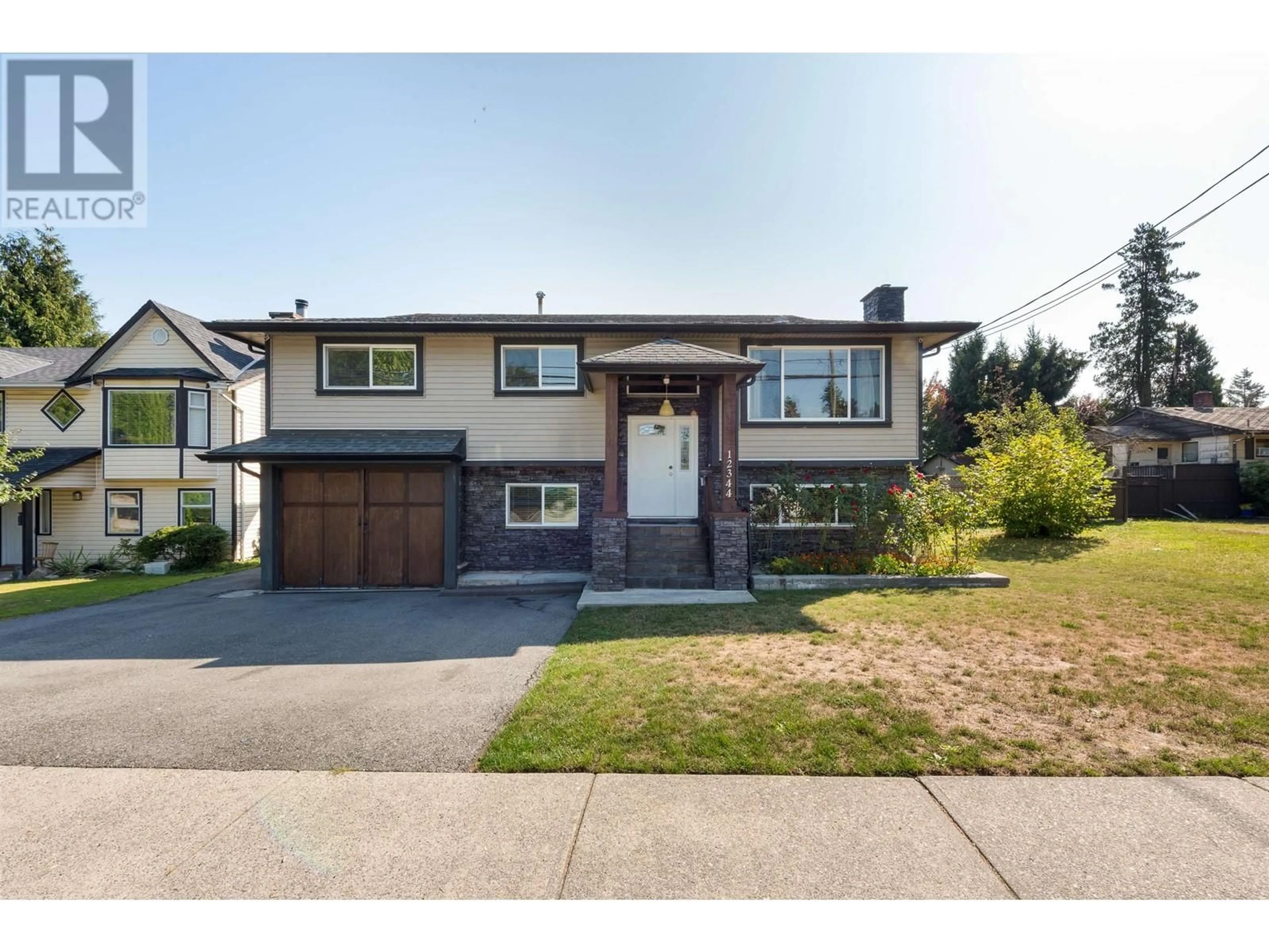 Home with vinyl exterior material, street for 12344 228 STREET, Maple Ridge British Columbia V2X6M4