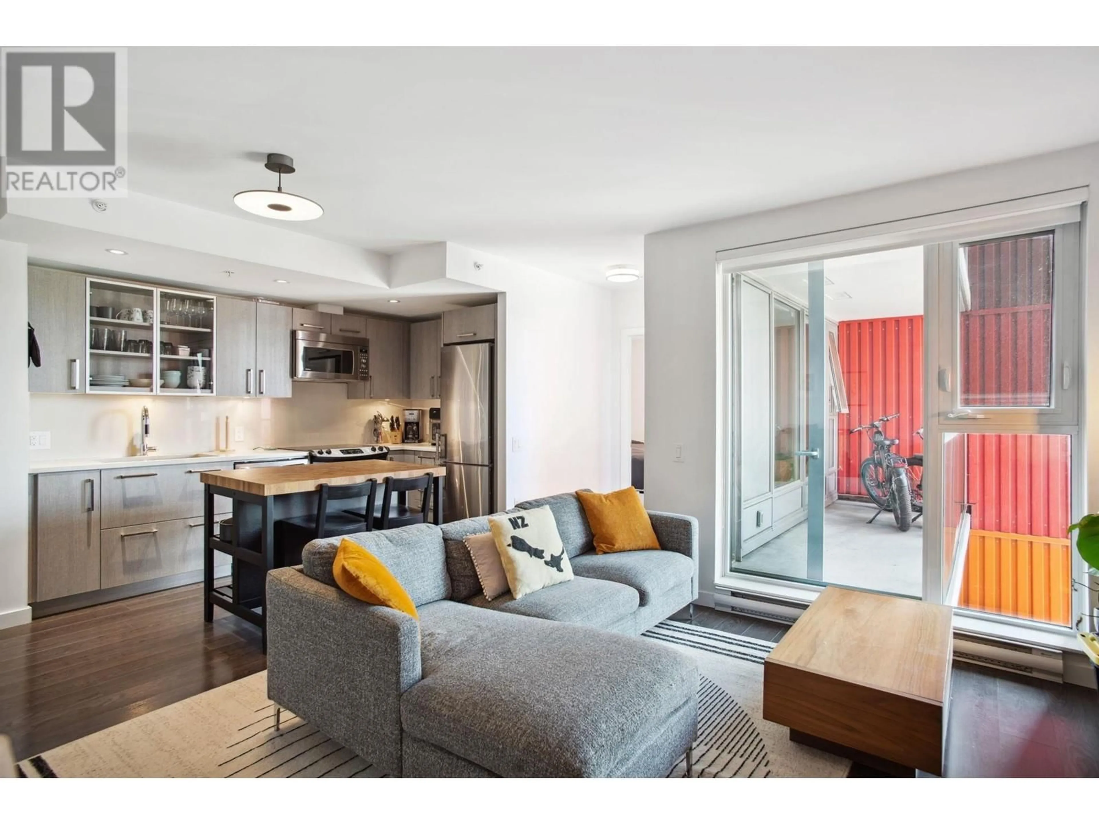 Living room with furniture, wood/laminate floor for 501 - 983 HASTINGS STREET, Vancouver British Columbia V6A0G9