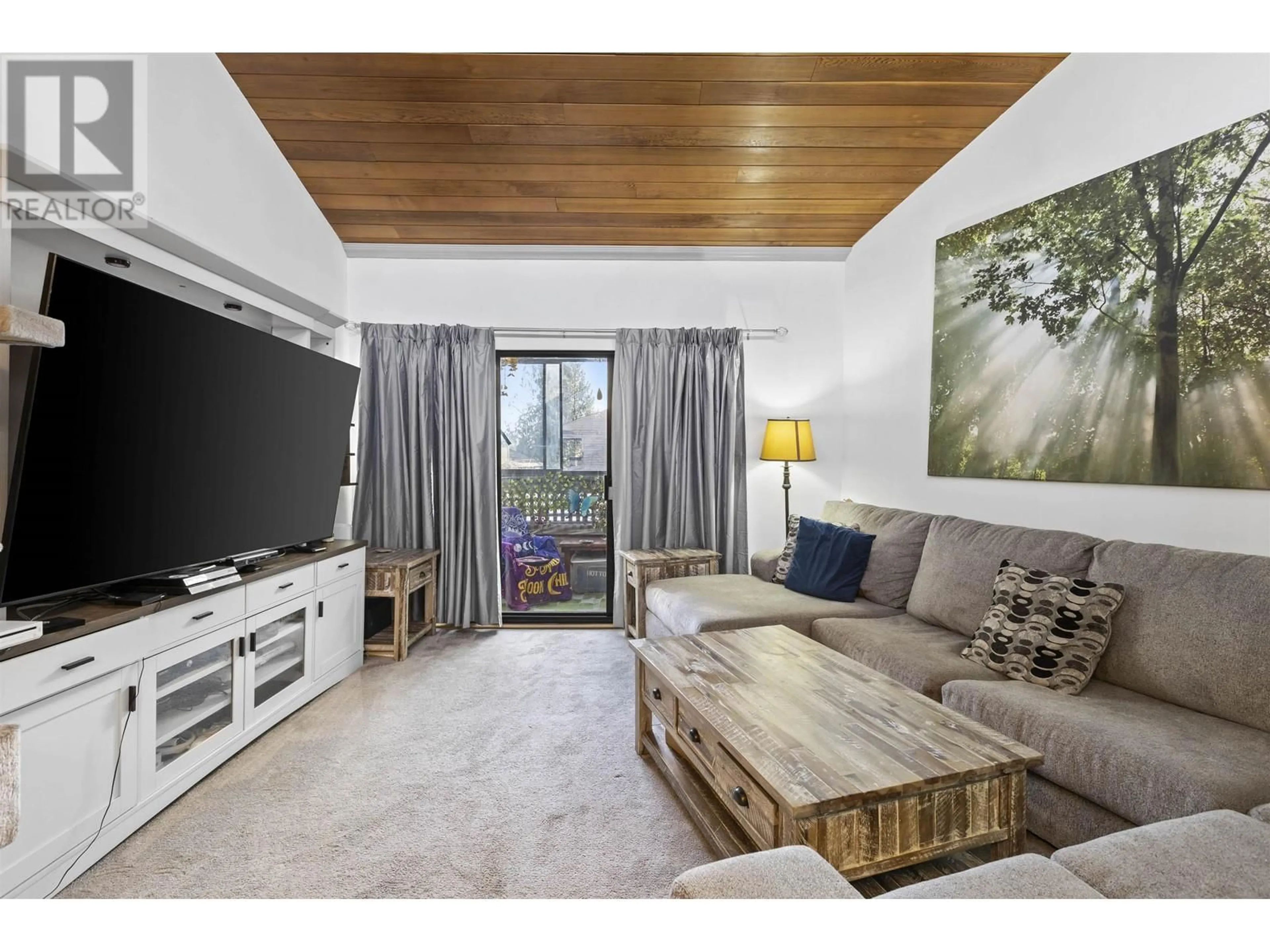 Living room with furniture, wood/laminate floor for 320 - 1195 PIPELINE ROAD, Coquitlam British Columbia V3B6J5