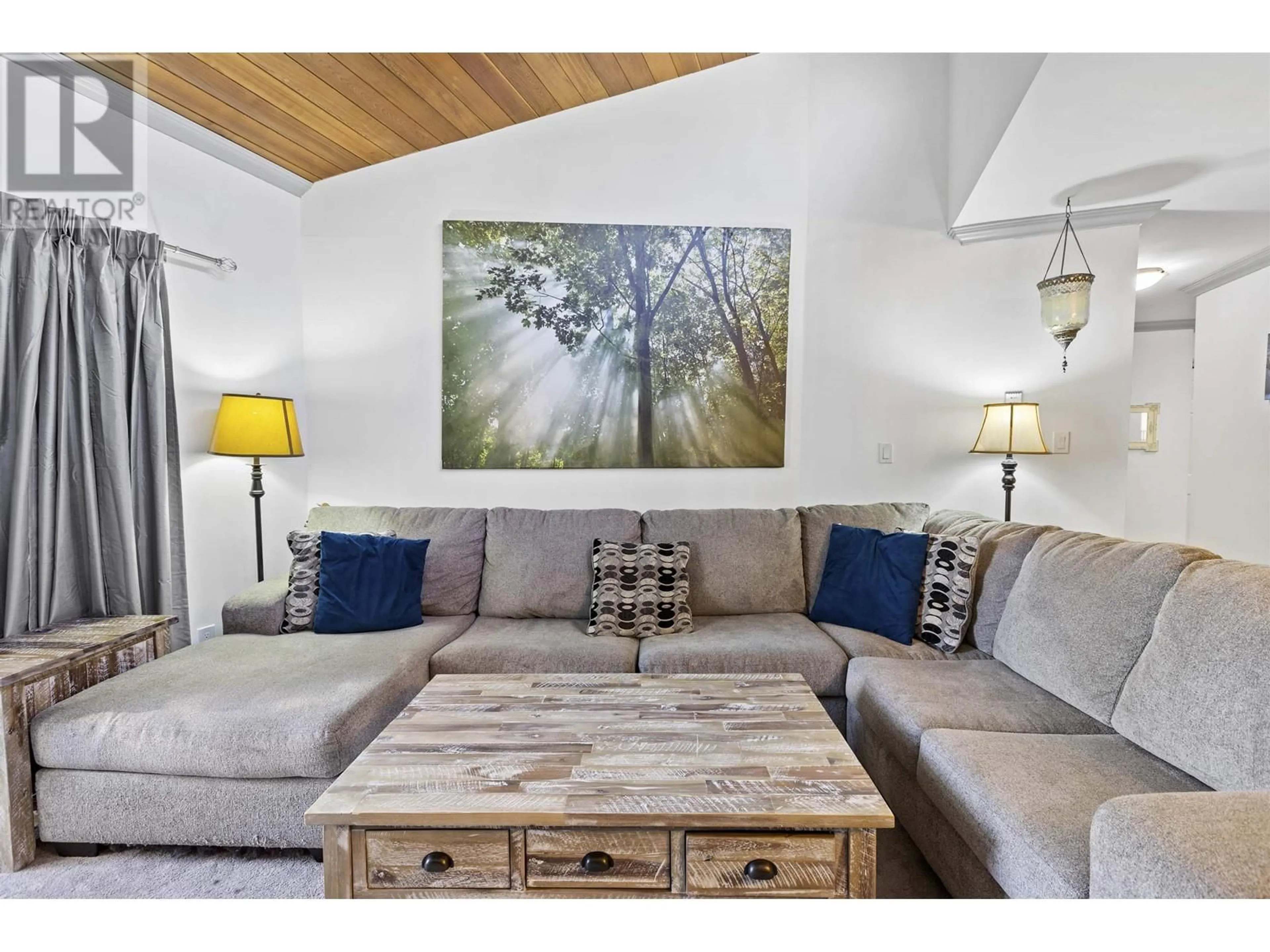 Living room with furniture, wood/laminate floor for 320 - 1195 PIPELINE ROAD, Coquitlam British Columbia V3B6J5