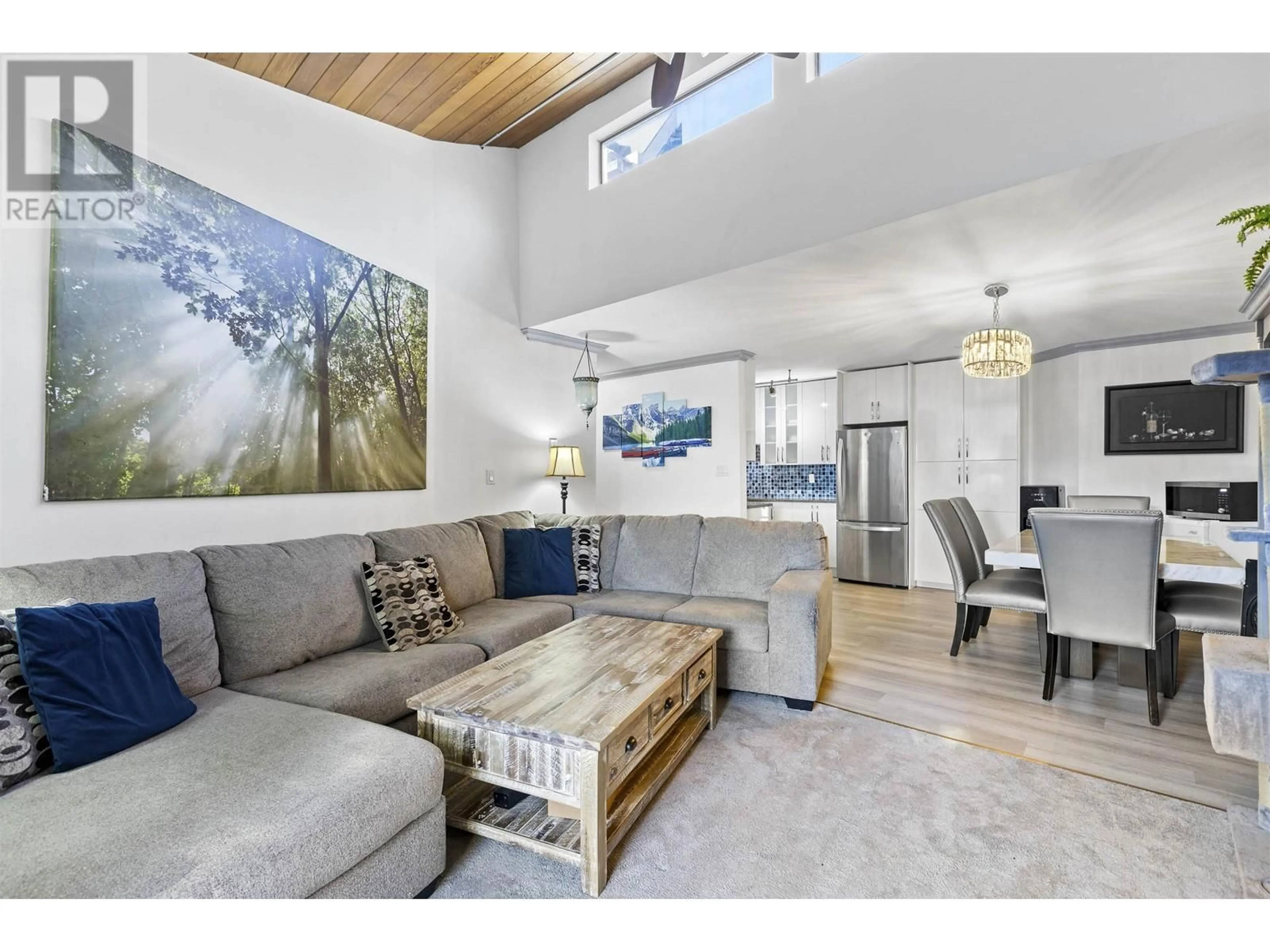 Living room with furniture, wood/laminate floor for 320 - 1195 PIPELINE ROAD, Coquitlam British Columbia V3B6J5