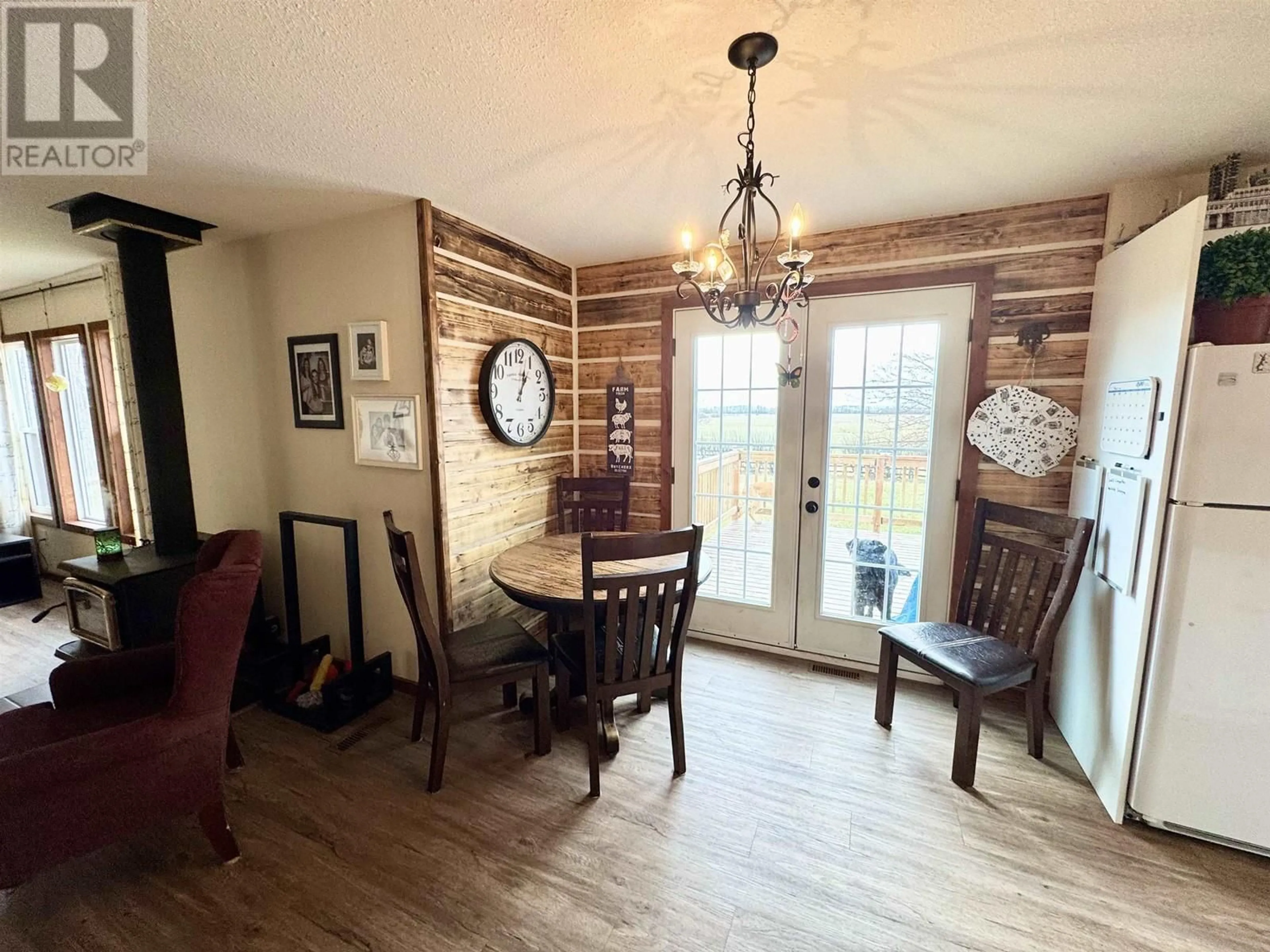 Dining room, wood/laminate floor for 1016 240 ROAD, Fort St. John British Columbia V0C1K0