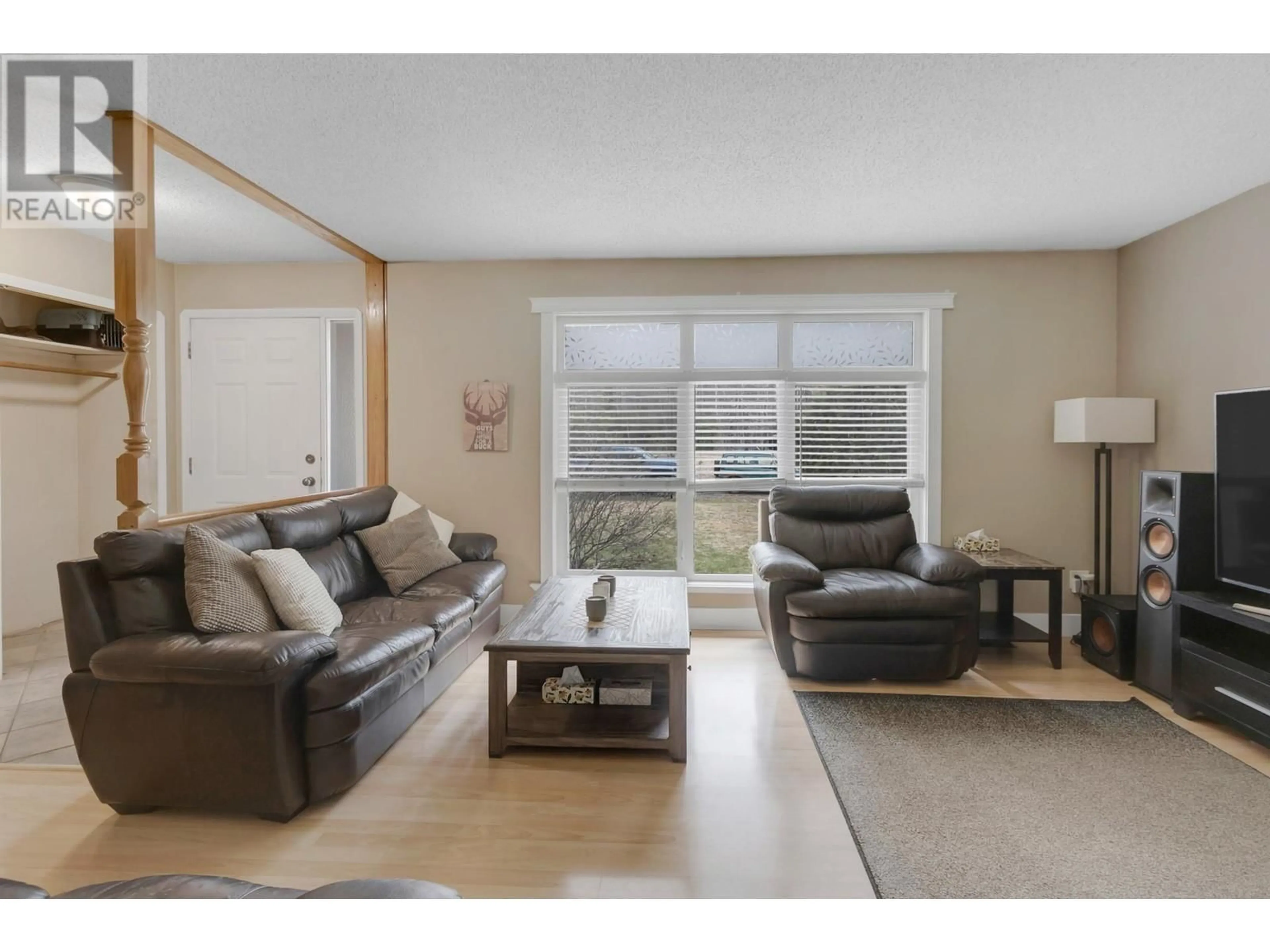 Living room with furniture, wood/laminate floor for 8277 FLAMINGO ROAD, Prince George British Columbia V2K5H2