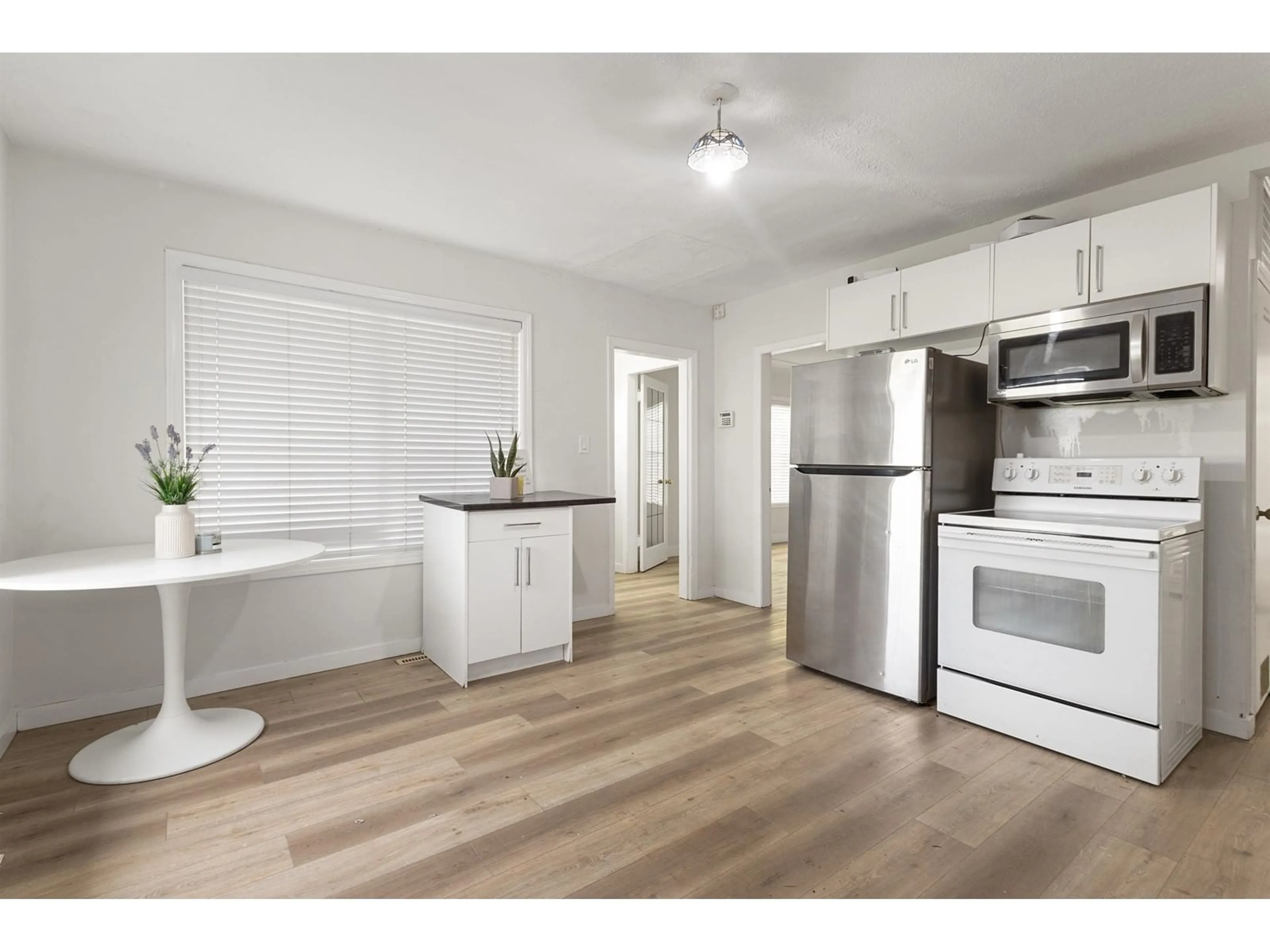 Open concept kitchen, wood/laminate floor for 46228 FIRST AVENUE, Chilliwack British Columbia V2P1W5