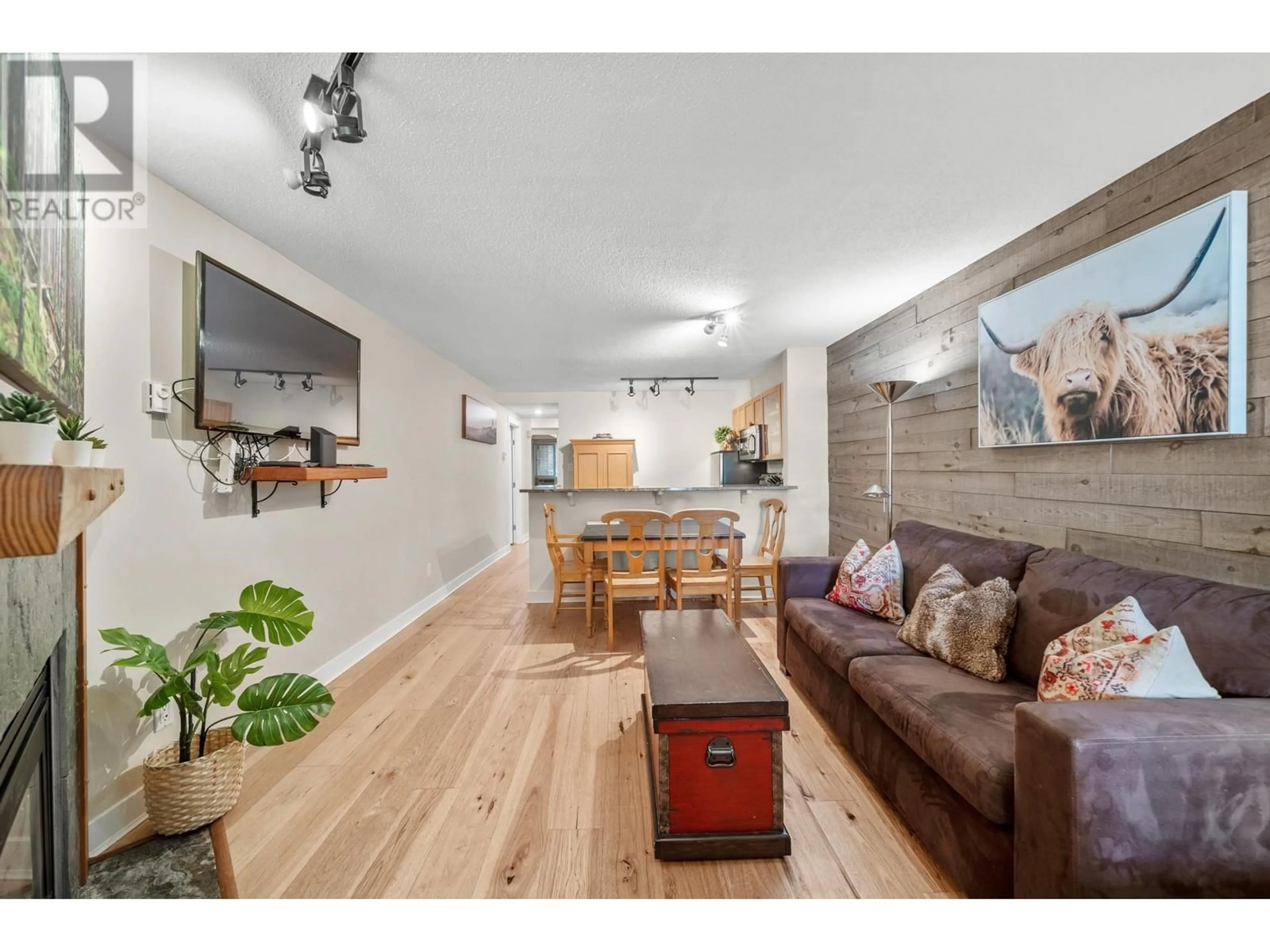 Living room with furniture, wood/laminate floor for 7/7a - 4388 NORTHLANDS BOULEVARD, Whistler British Columbia V8E1C6