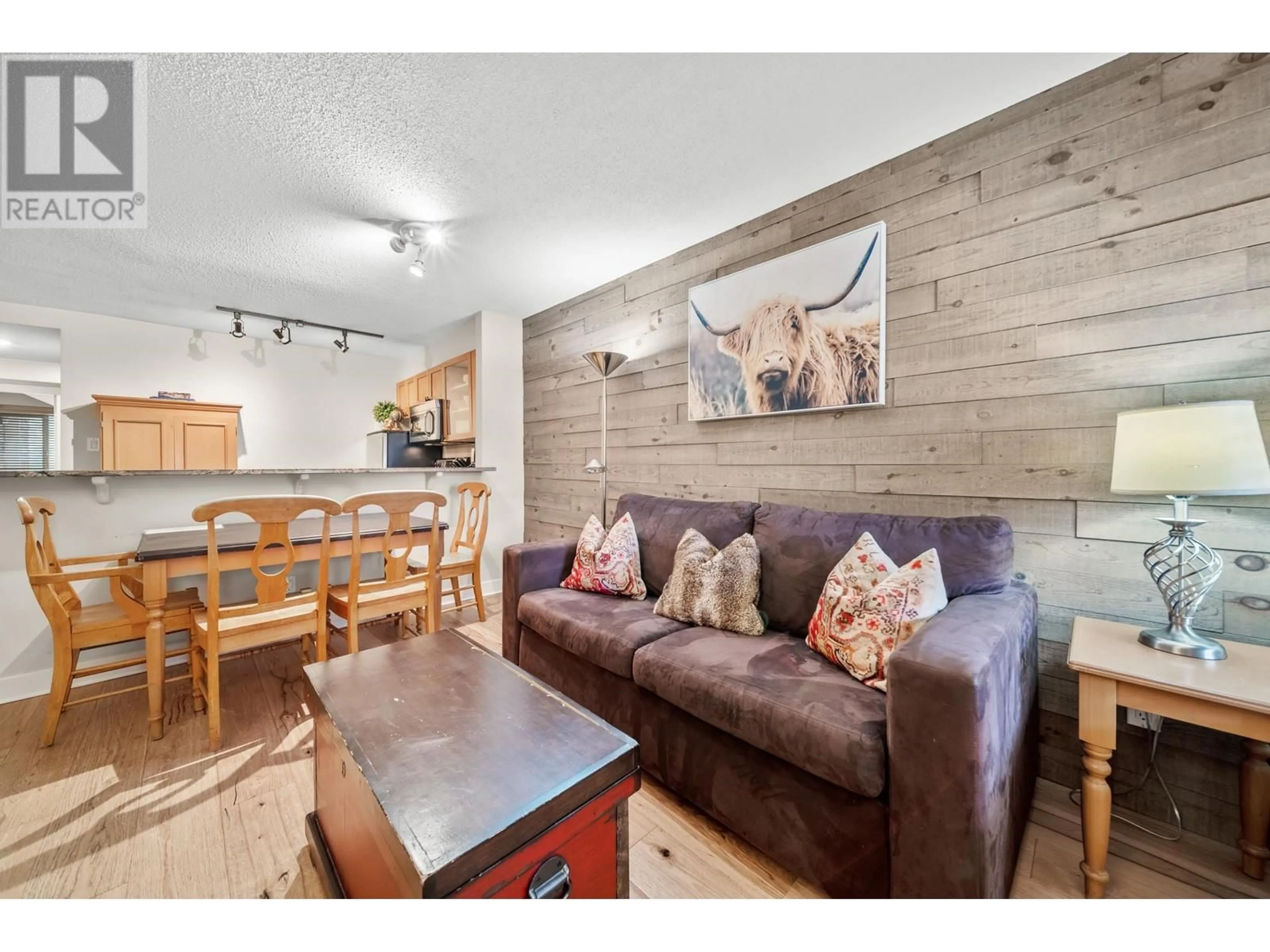 Living room with furniture, wood/laminate floor for 7/7a - 4388 NORTHLANDS BOULEVARD, Whistler British Columbia V8E1C6
