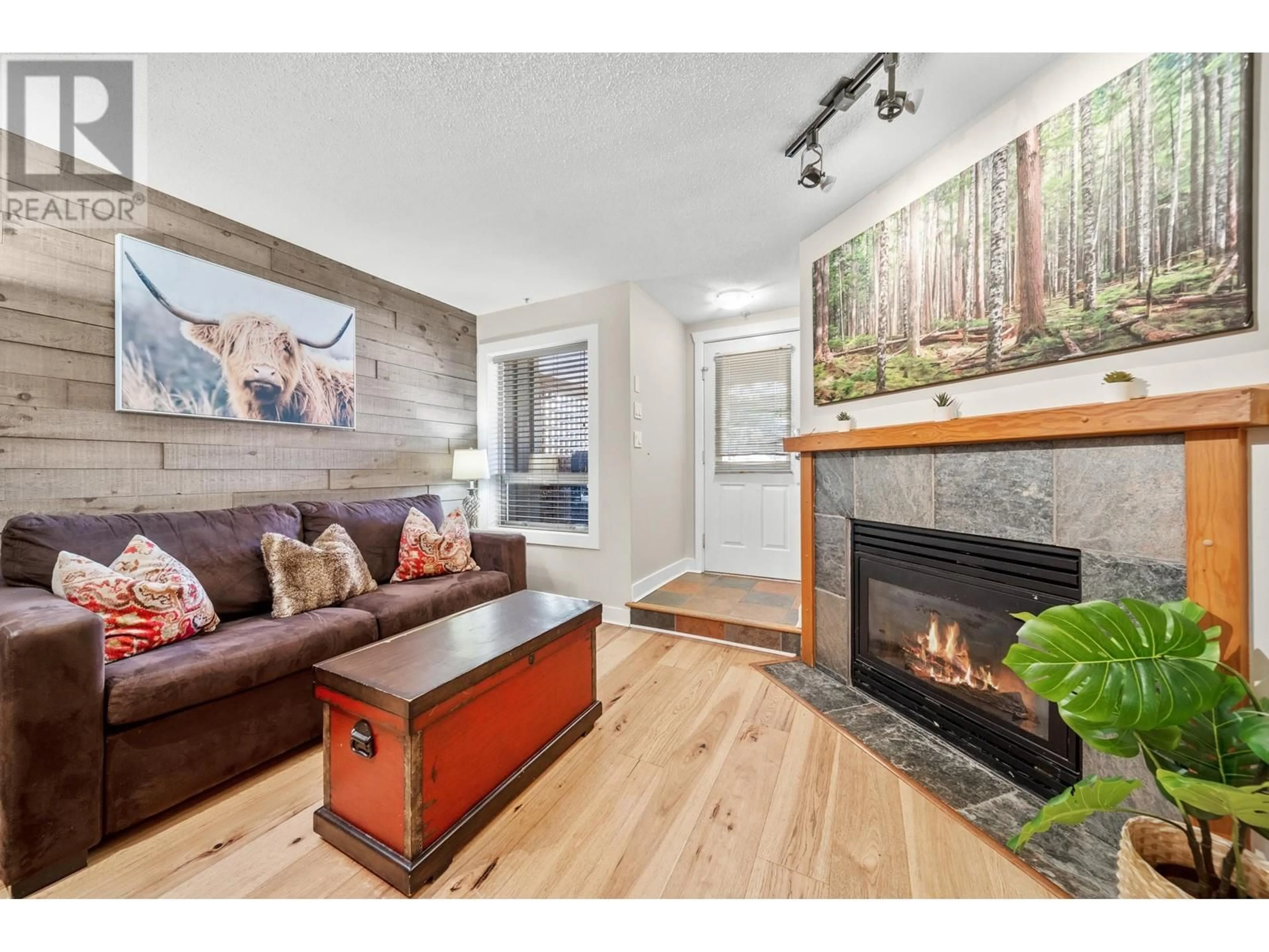 Living room with furniture, wood/laminate floor for 7/7a - 4388 NORTHLANDS BOULEVARD, Whistler British Columbia V8E1C6