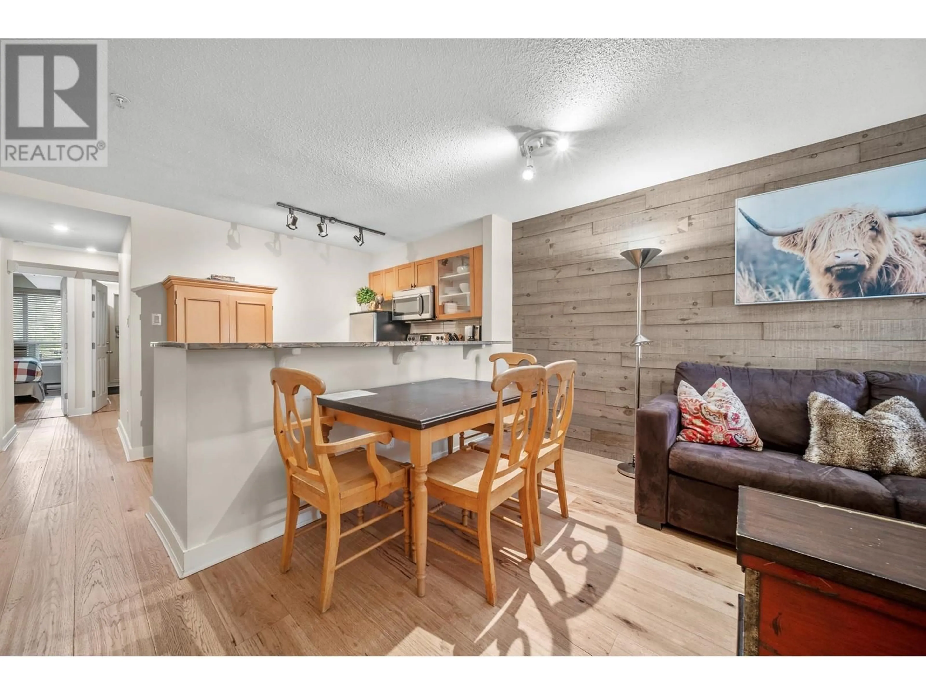 Open concept kitchen, wood/laminate floor for 7/7a - 4388 NORTHLANDS BOULEVARD, Whistler British Columbia V8E1C6