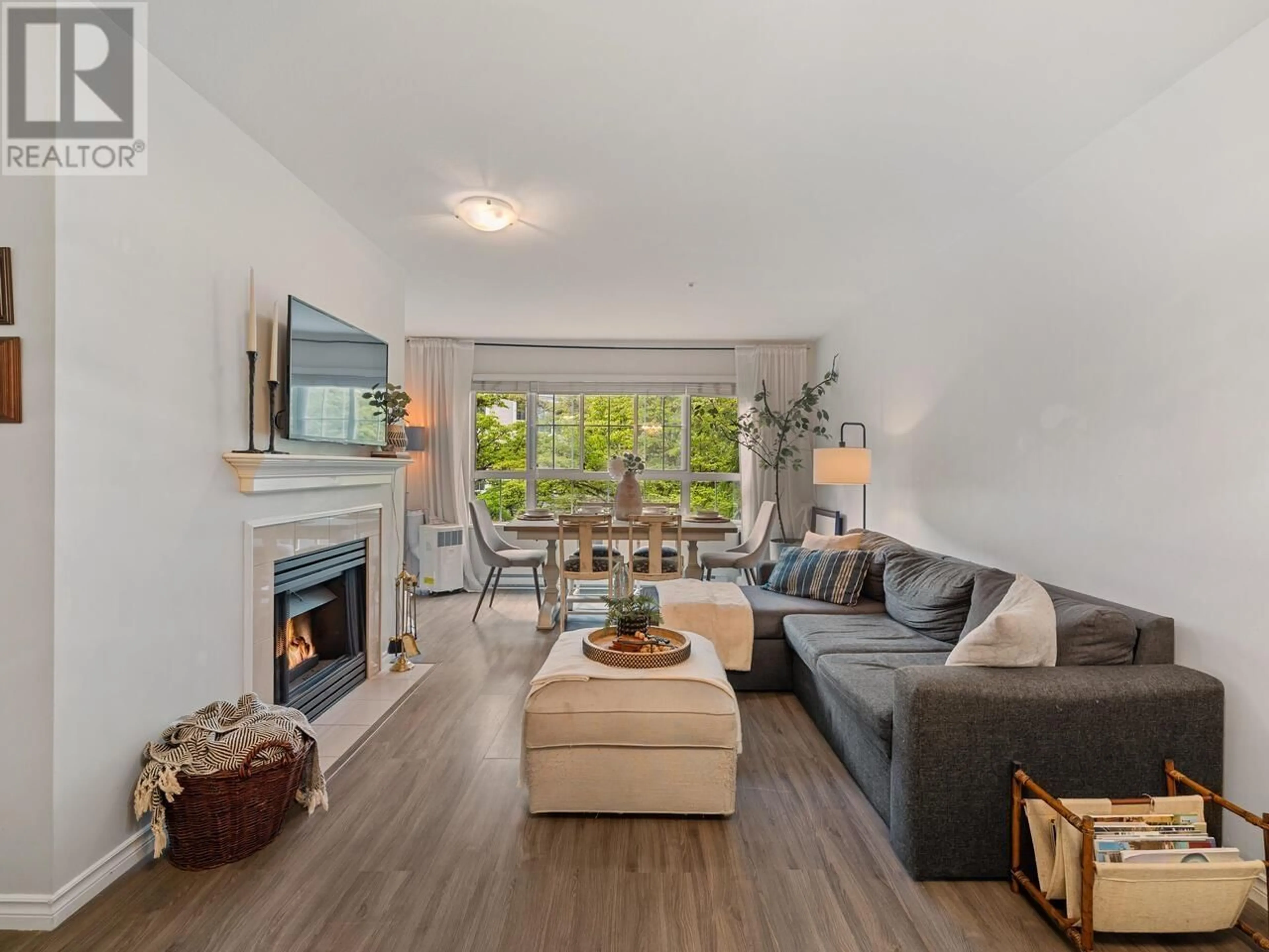 Living room with furniture, wood/laminate floor for 223 - 2980 PRINCESS CRESCENT, Coquitlam British Columbia V3B7R4