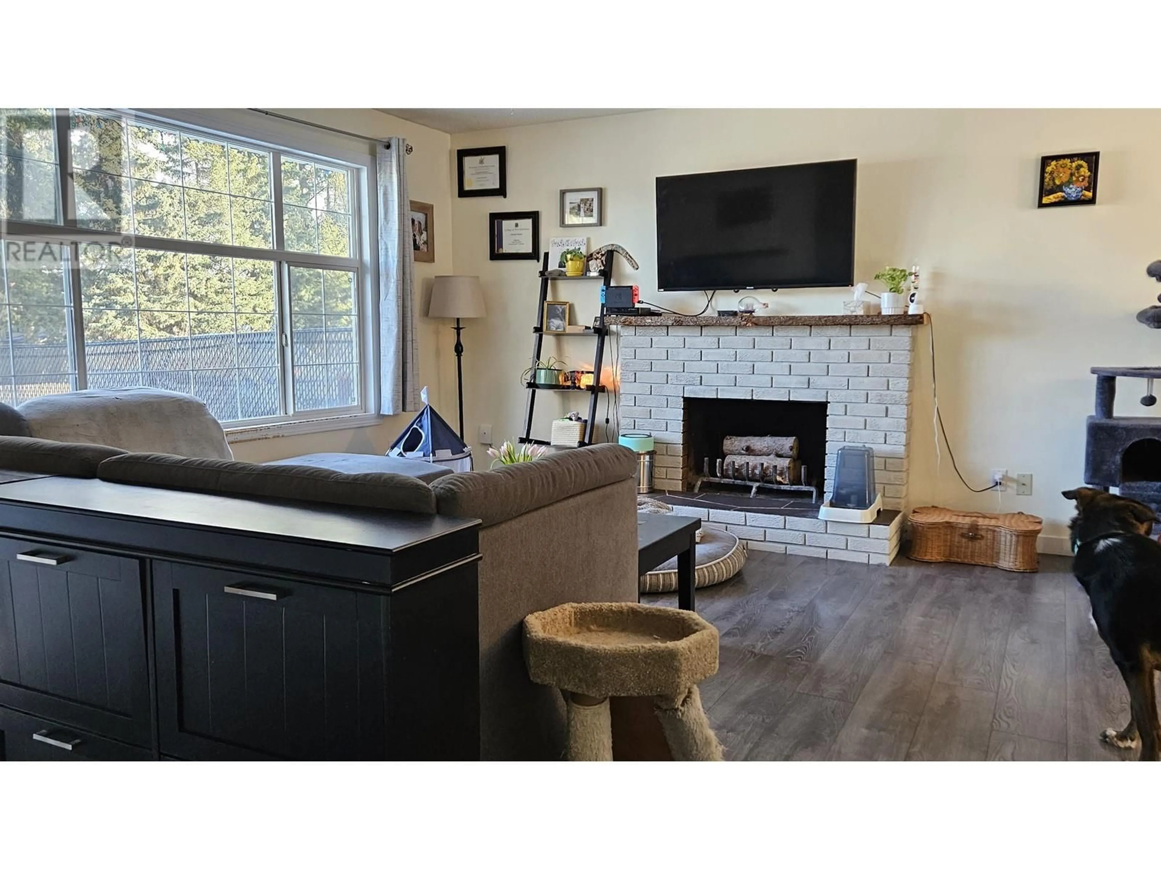 Living room with furniture, wood/laminate floor for 6109 CALEDONIA CRESCENT, Prince George British Columbia V2N2H5