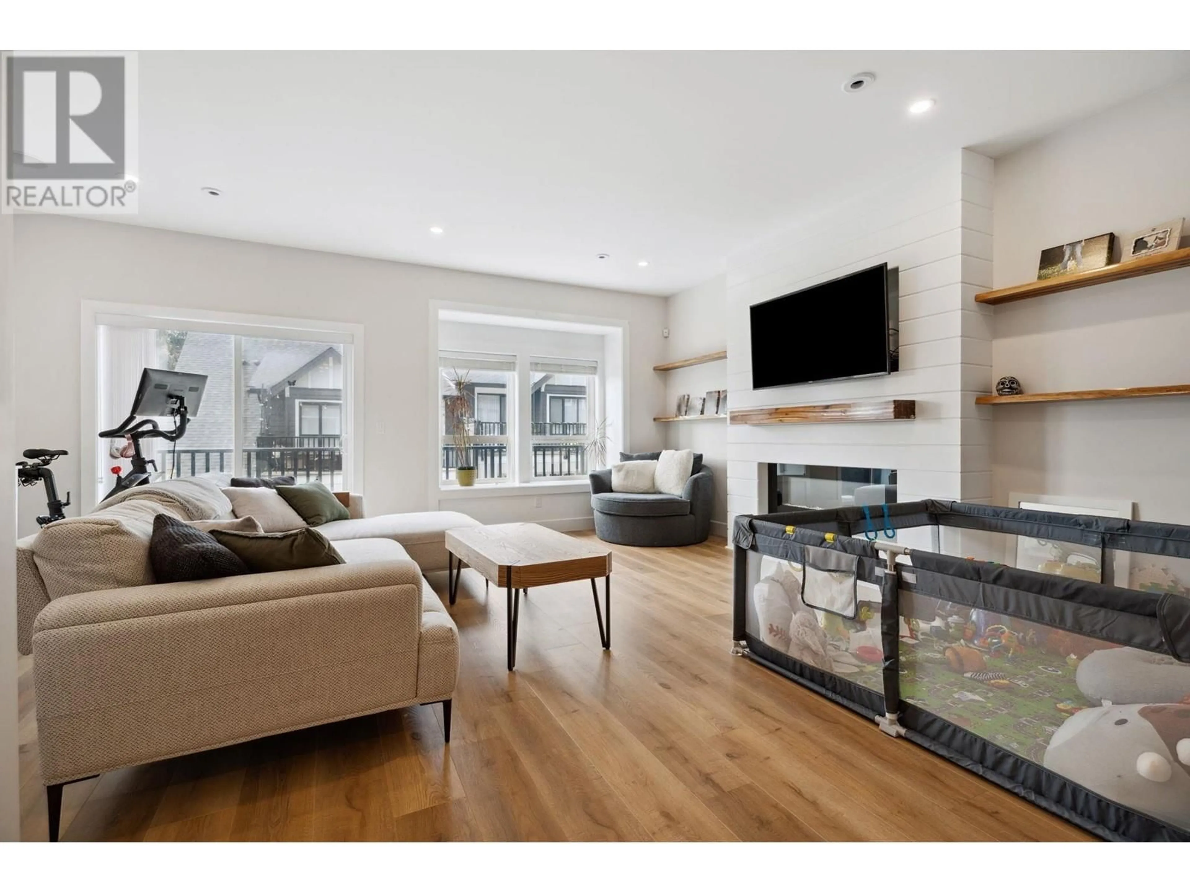 Living room with furniture, wood/laminate floor for 117 - 3409 HARPER ROAD, Coquitlam British Columbia V3E3H1