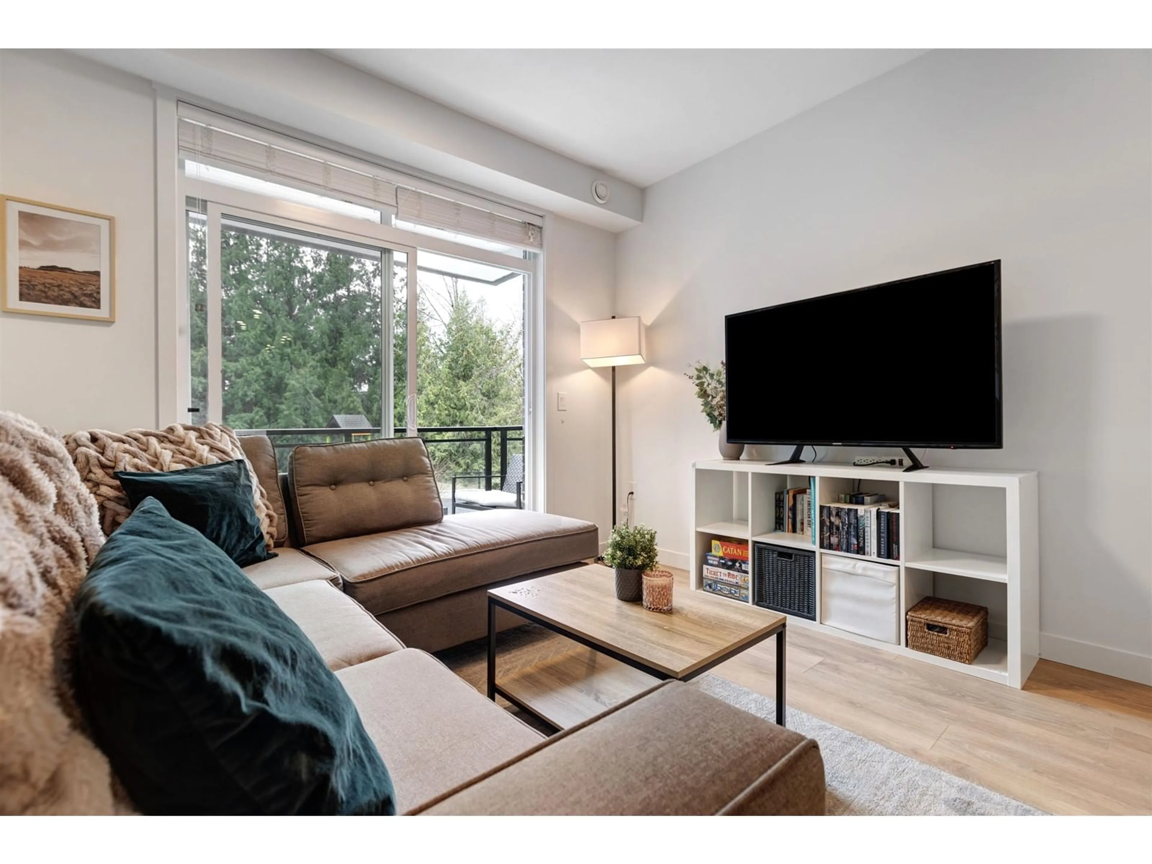 Living room with furniture, wood/laminate floor for 215 - 5415 BRYDON, Langley British Columbia V3A0N4