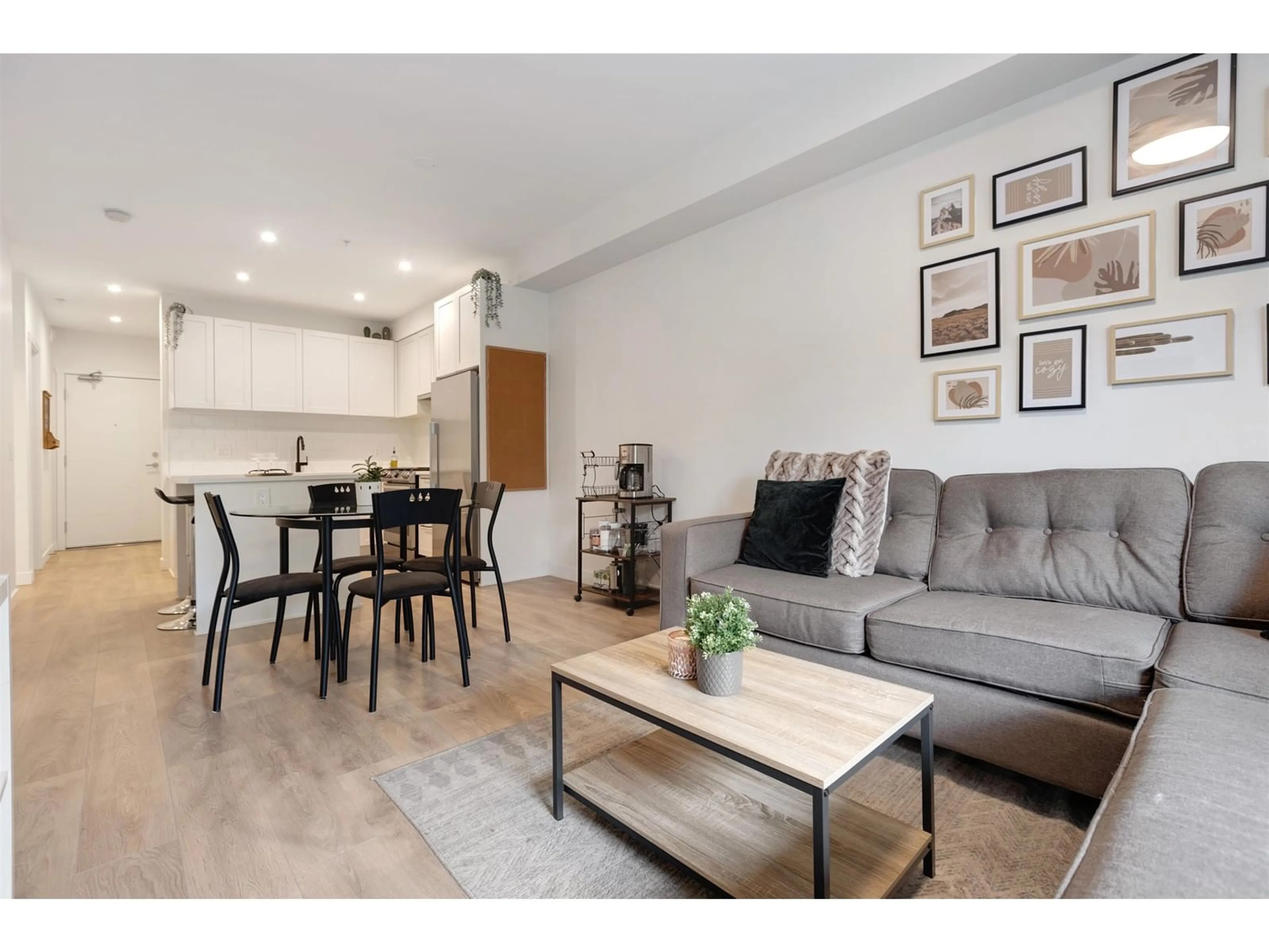 Living room with furniture, wood/laminate floor for 215 - 5415 BRYDON, Langley British Columbia V3A0N4