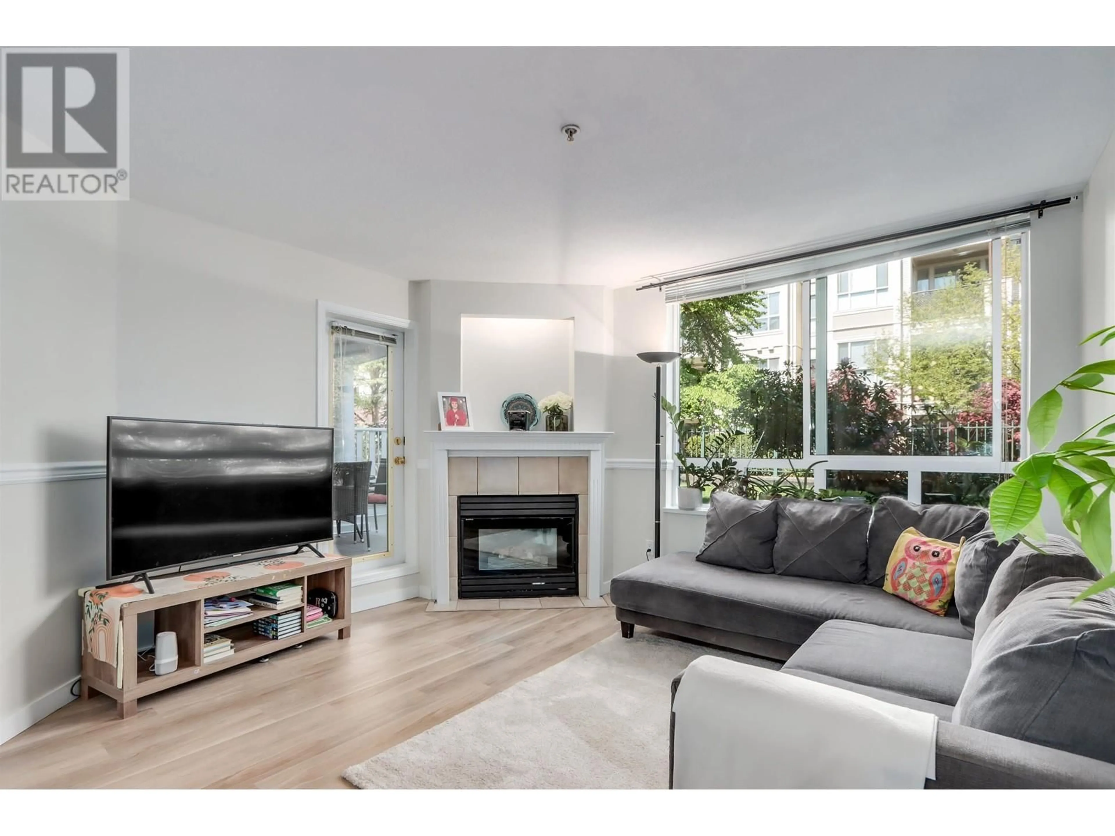 Living room with furniture, wood/laminate floor for 107 - 2485 ATKINS AVENUE, Port Coquitlam British Columbia V3C1Z1