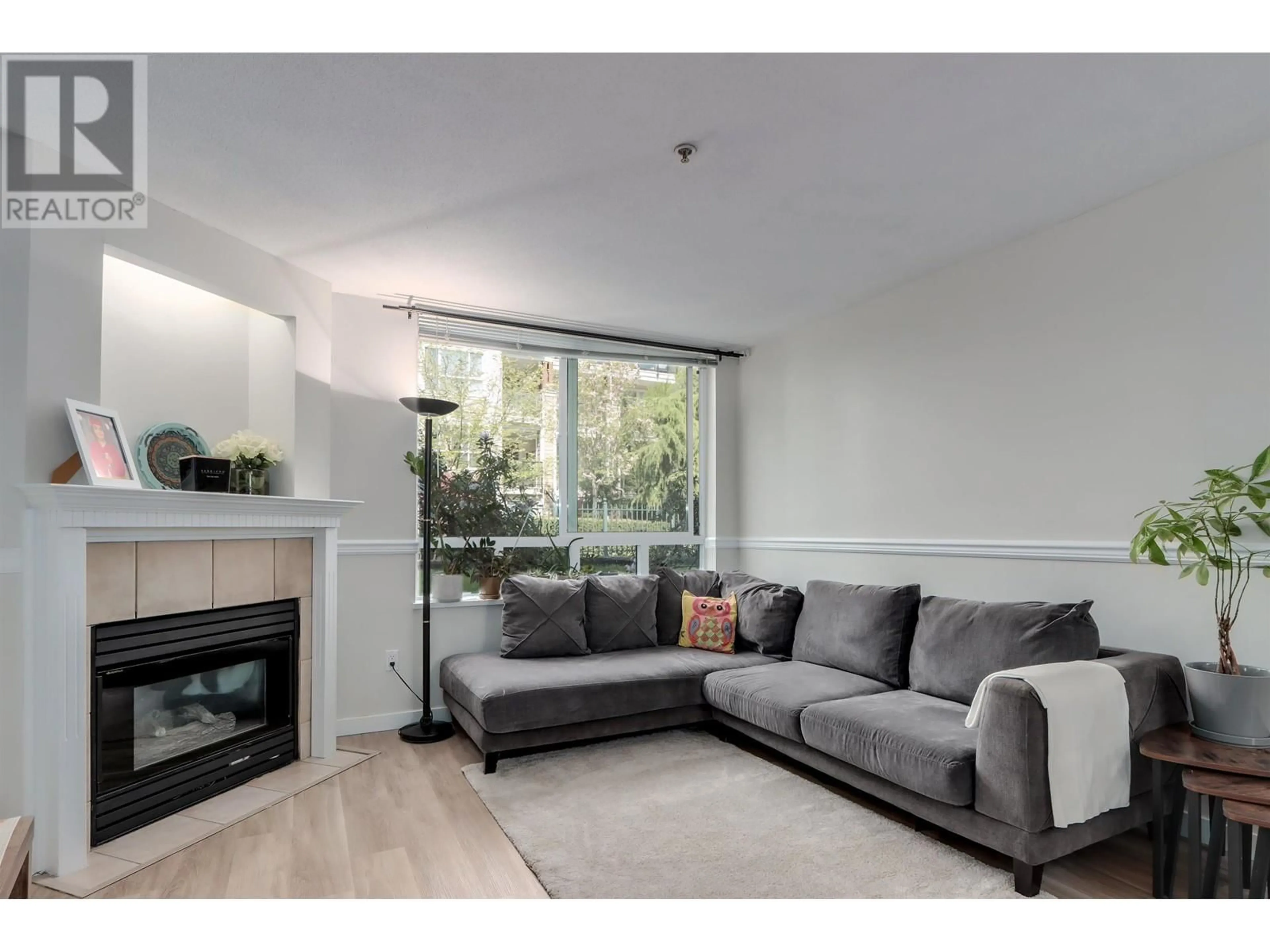 Living room with furniture, wood/laminate floor for 107 - 2485 ATKINS AVENUE, Port Coquitlam British Columbia V3C1Z1