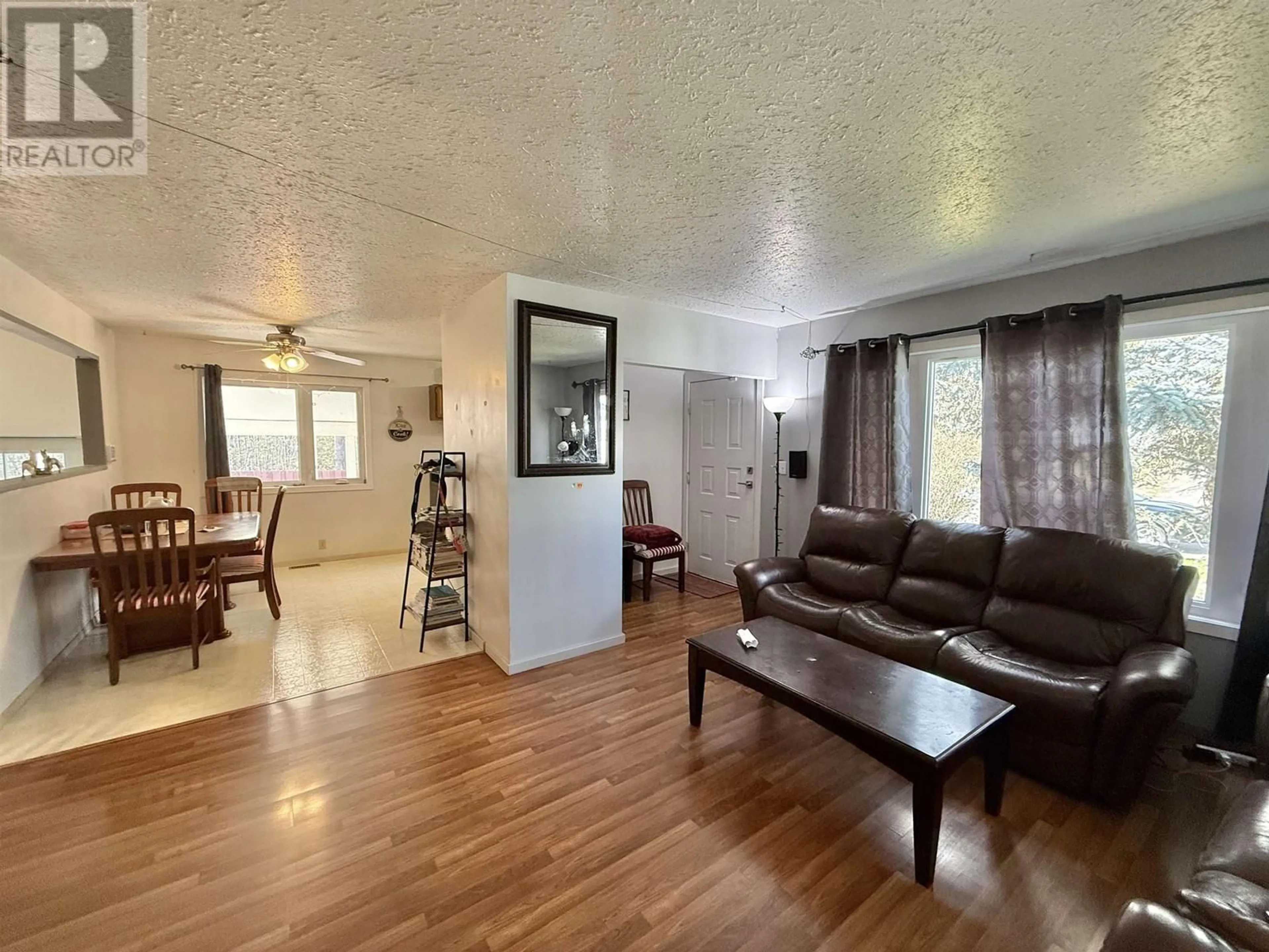 Living room with furniture, wood/laminate floor for 400 PIERCE CRESCENT, Quesnel British Columbia V2J5K1