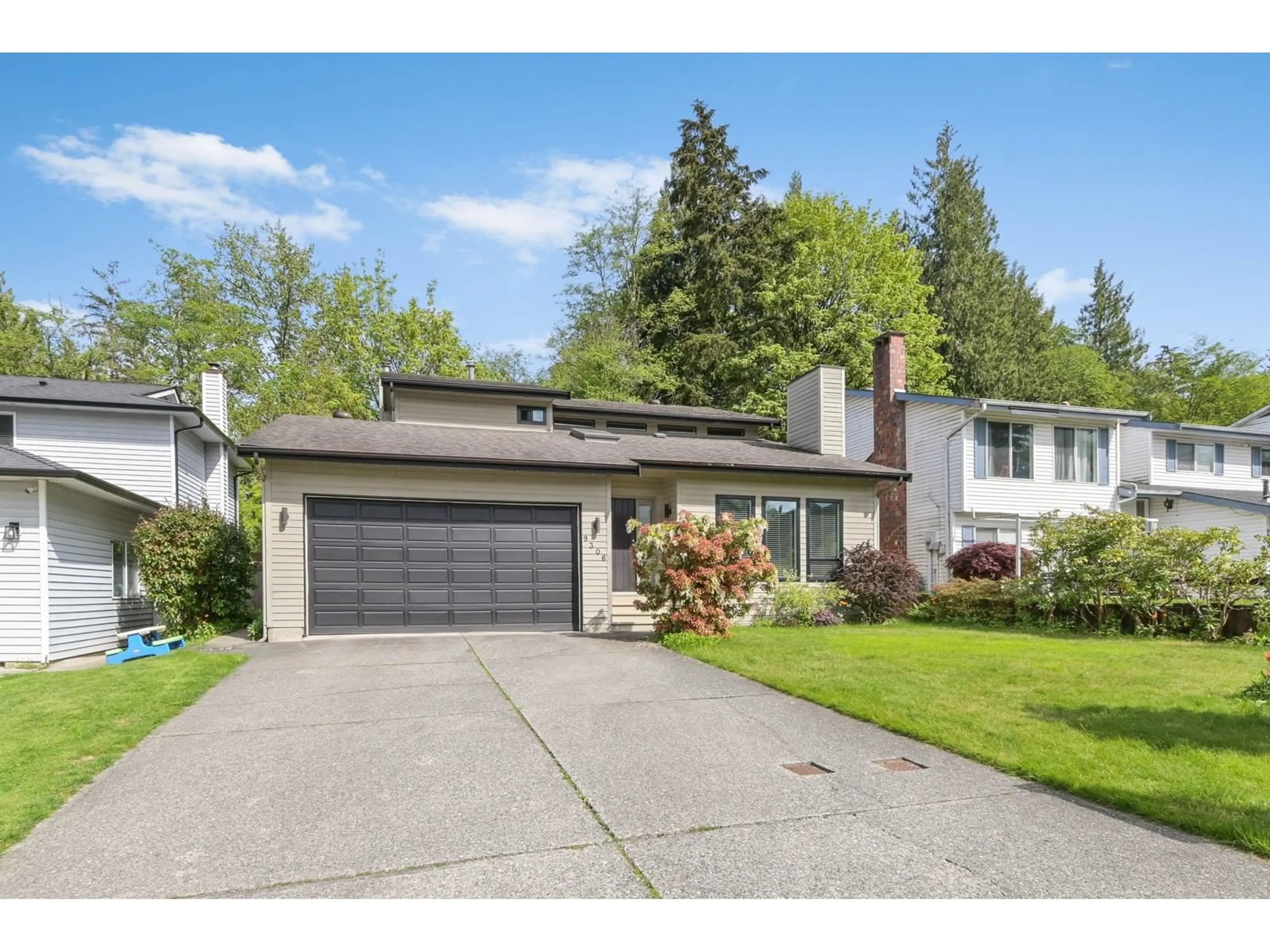 Home with vinyl exterior material, street for 9306 214B, Langley British Columbia V1M1R3