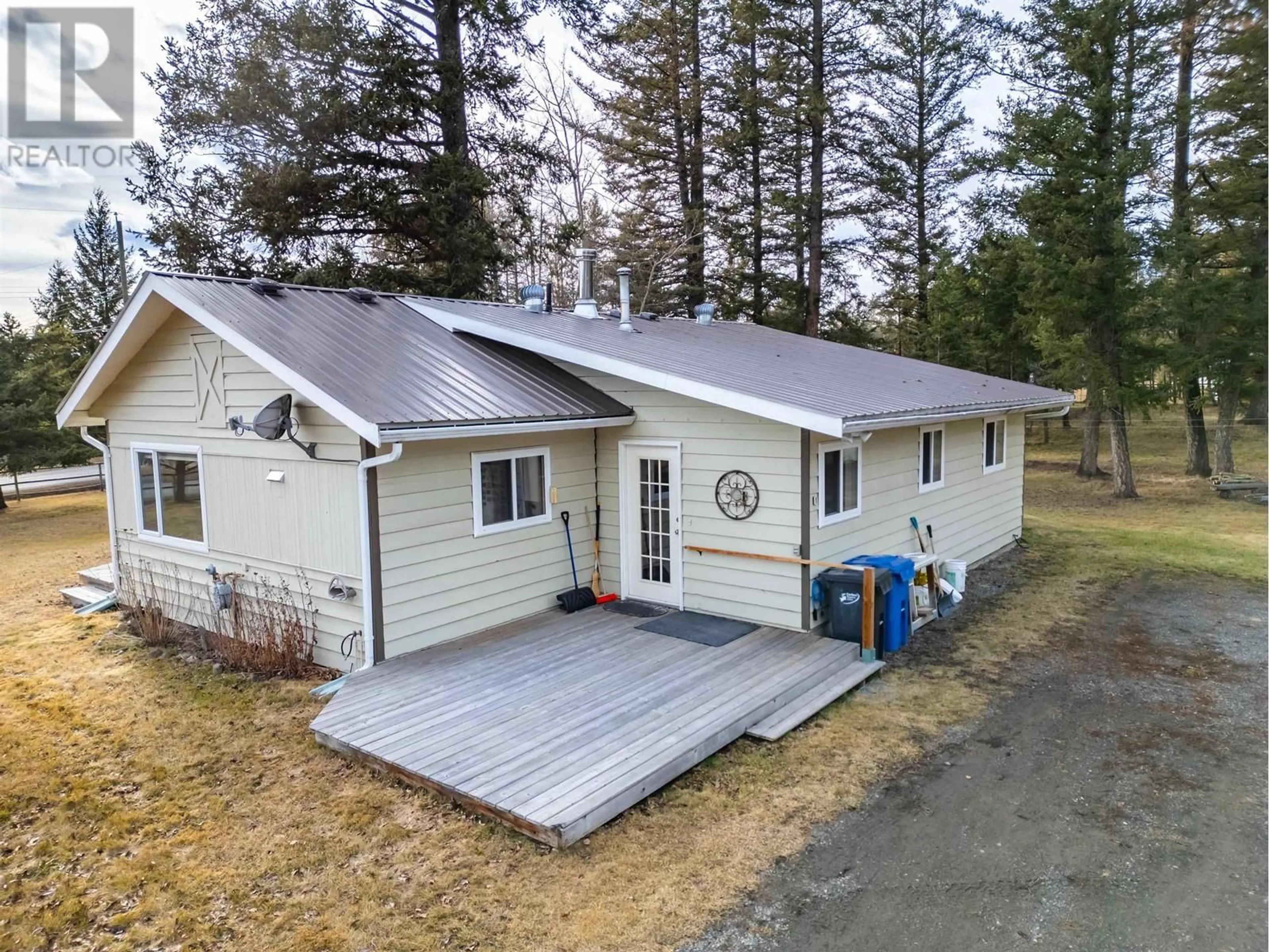 A pic from outside/outdoor area/front of a property/back of a property/a pic from drone, unknown for 4734 KITWANGA DRIVE, 108 Mile Ranch British Columbia V0K2Z0