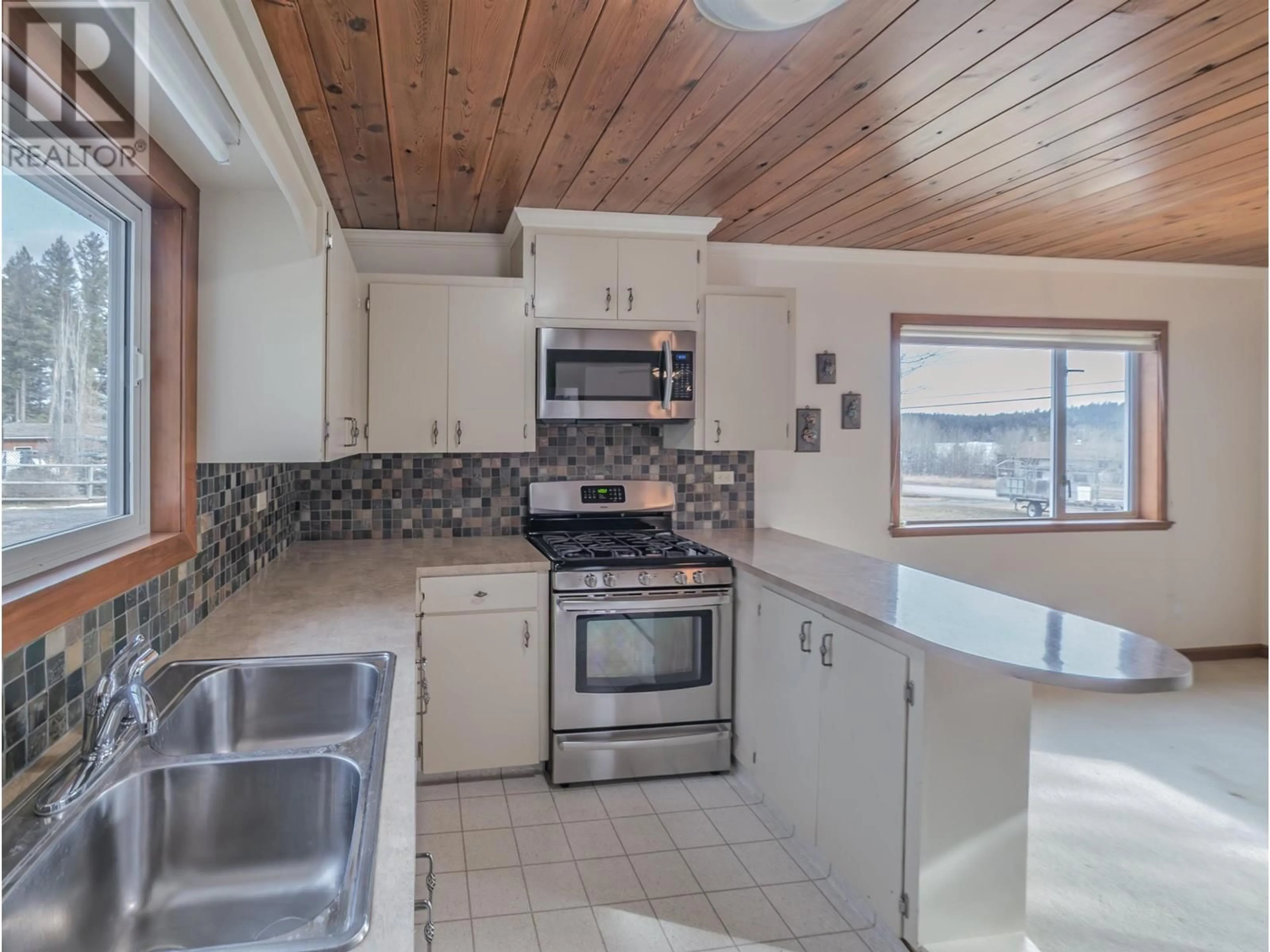 Open concept kitchen, unknown for 4734 KITWANGA DRIVE, 108 Mile Ranch British Columbia V0K2Z0