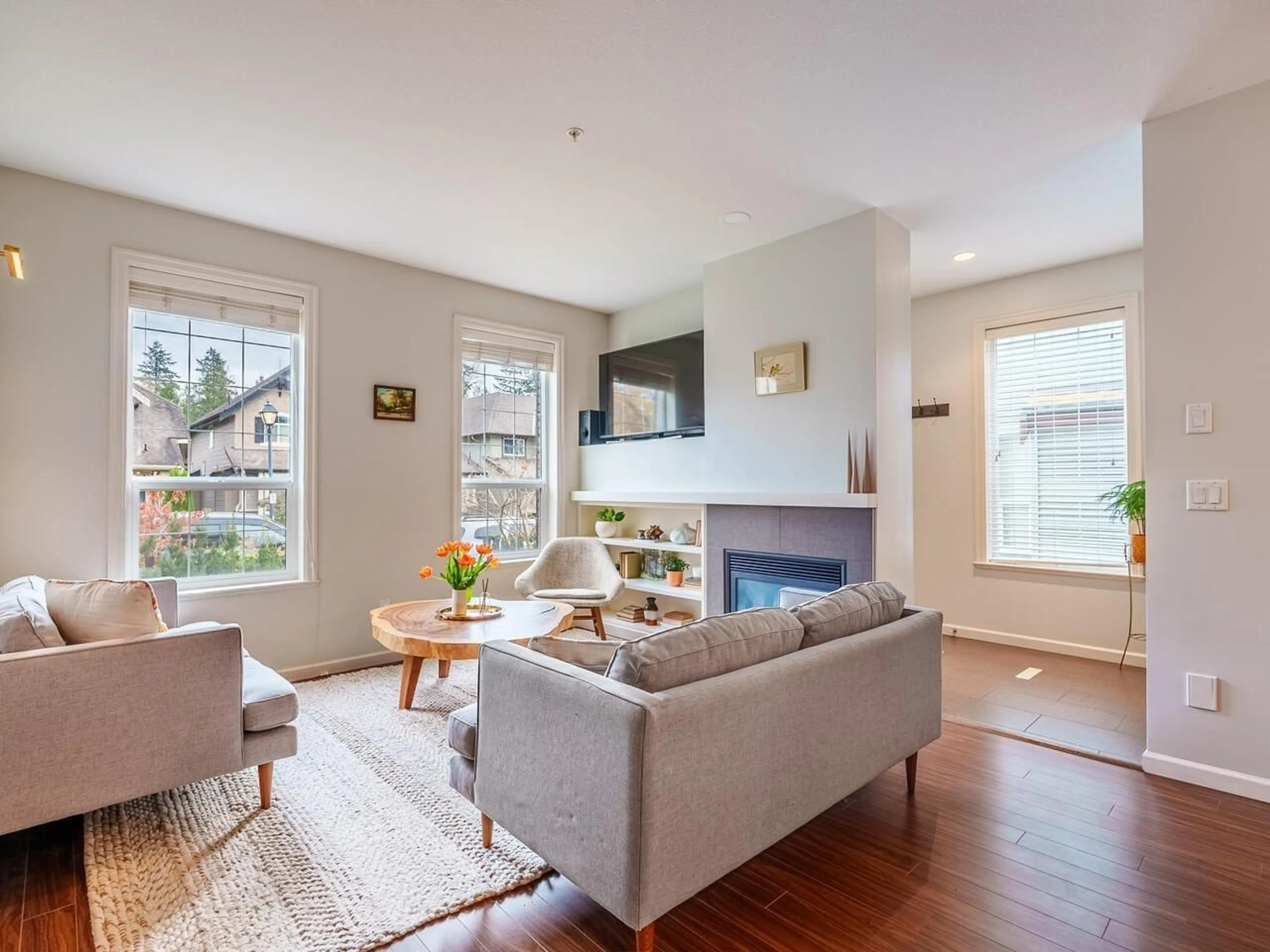 Living room with furniture, wood/laminate floor for 1 - 6885 208A, Langley British Columbia V2Y0G2