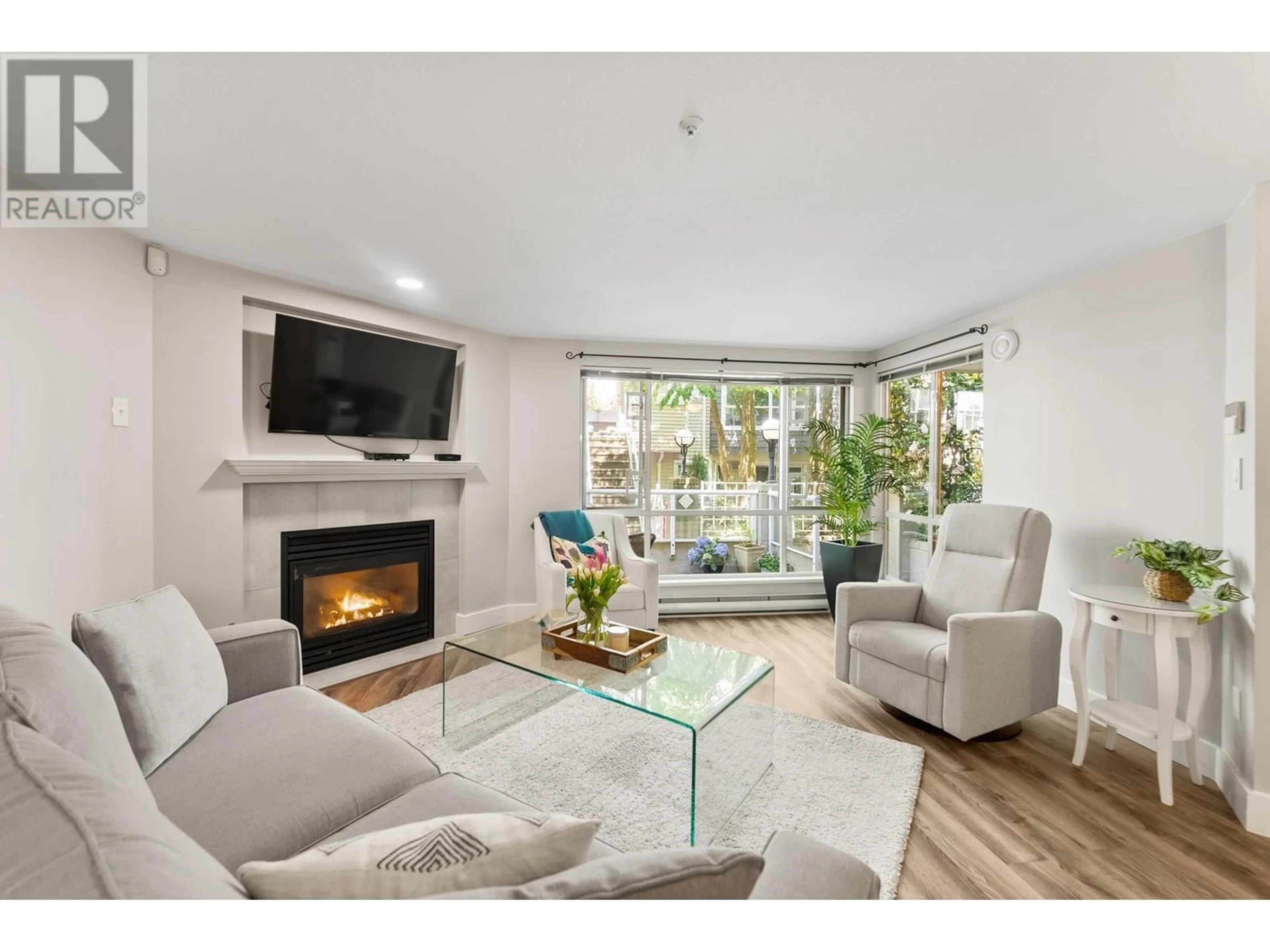 Living room with furniture, wood/laminate floor for 104 - 789 W 16TH AVENUE, Vancouver British Columbia V5Z1S8
