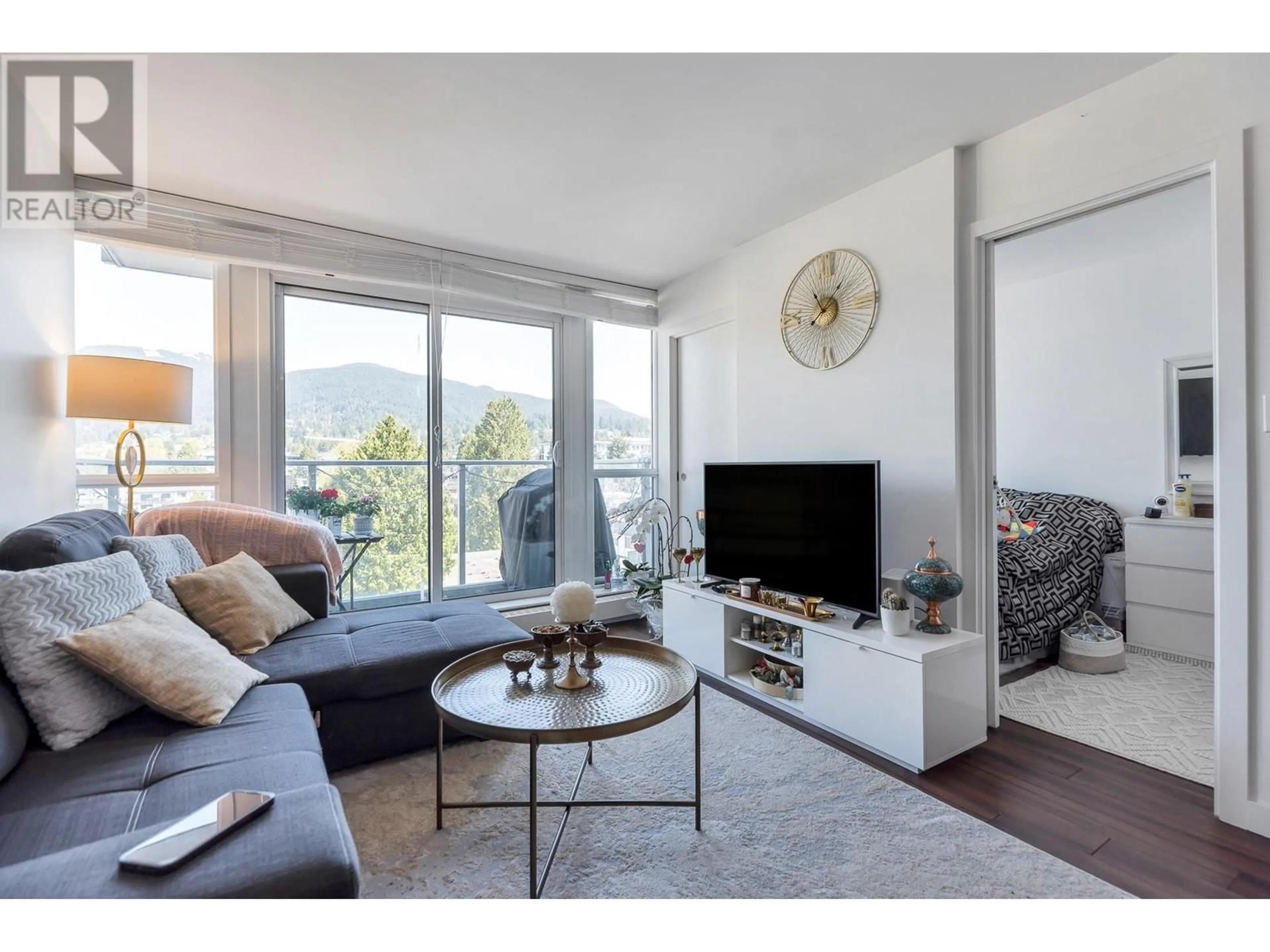 Living room with furniture, wood/laminate floor for 704 - 135 17TH STREET, North Vancouver British Columbia V7L0C4