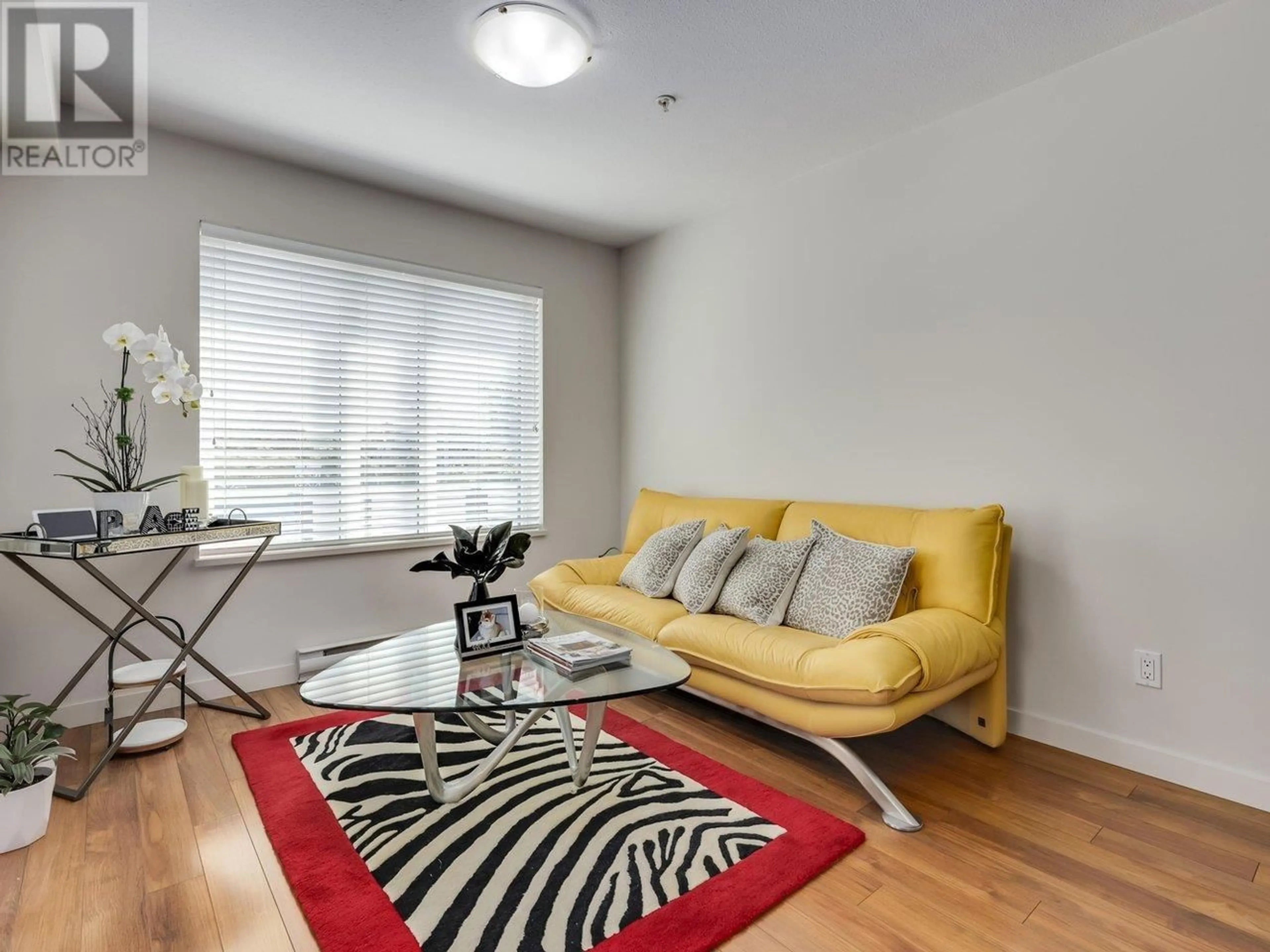 Living room with furniture, unknown for 304 - 1673 LLOYD AVENUE, North Vancouver British Columbia V7P0A9