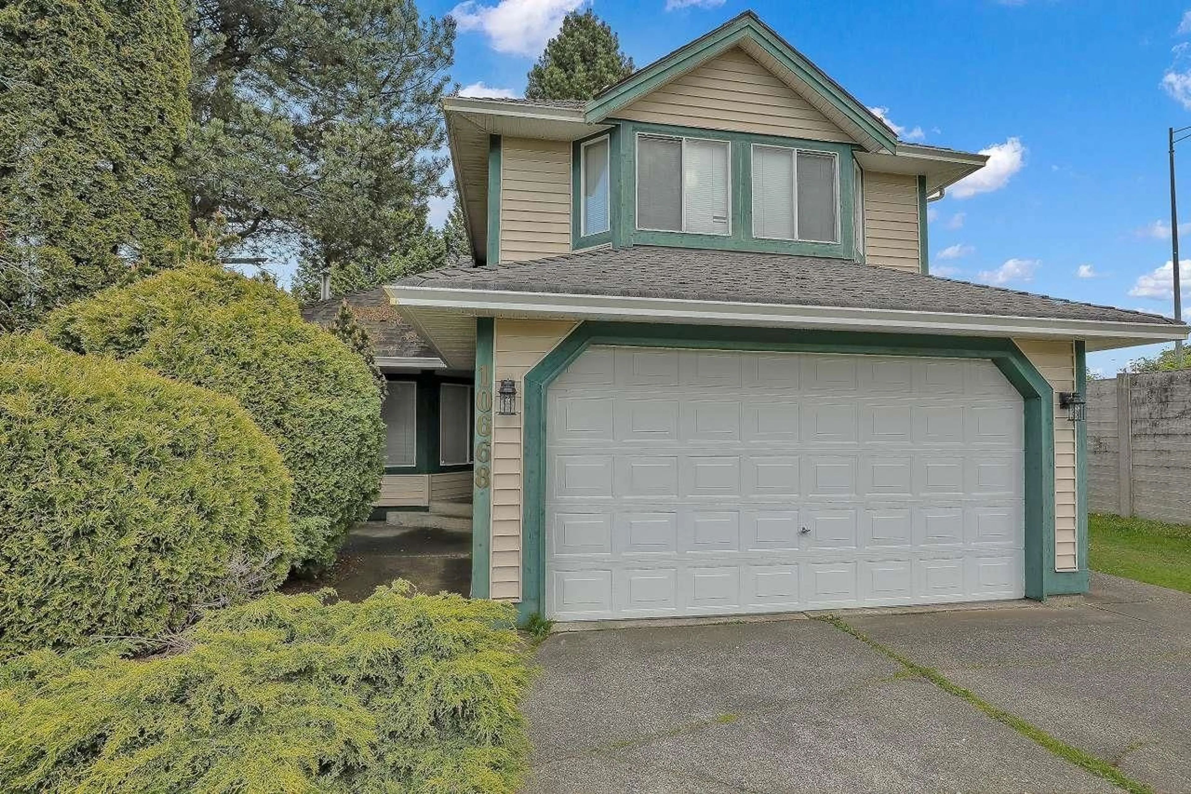Home with vinyl exterior material, street for 10668 155A, Surrey British Columbia V3R9X5