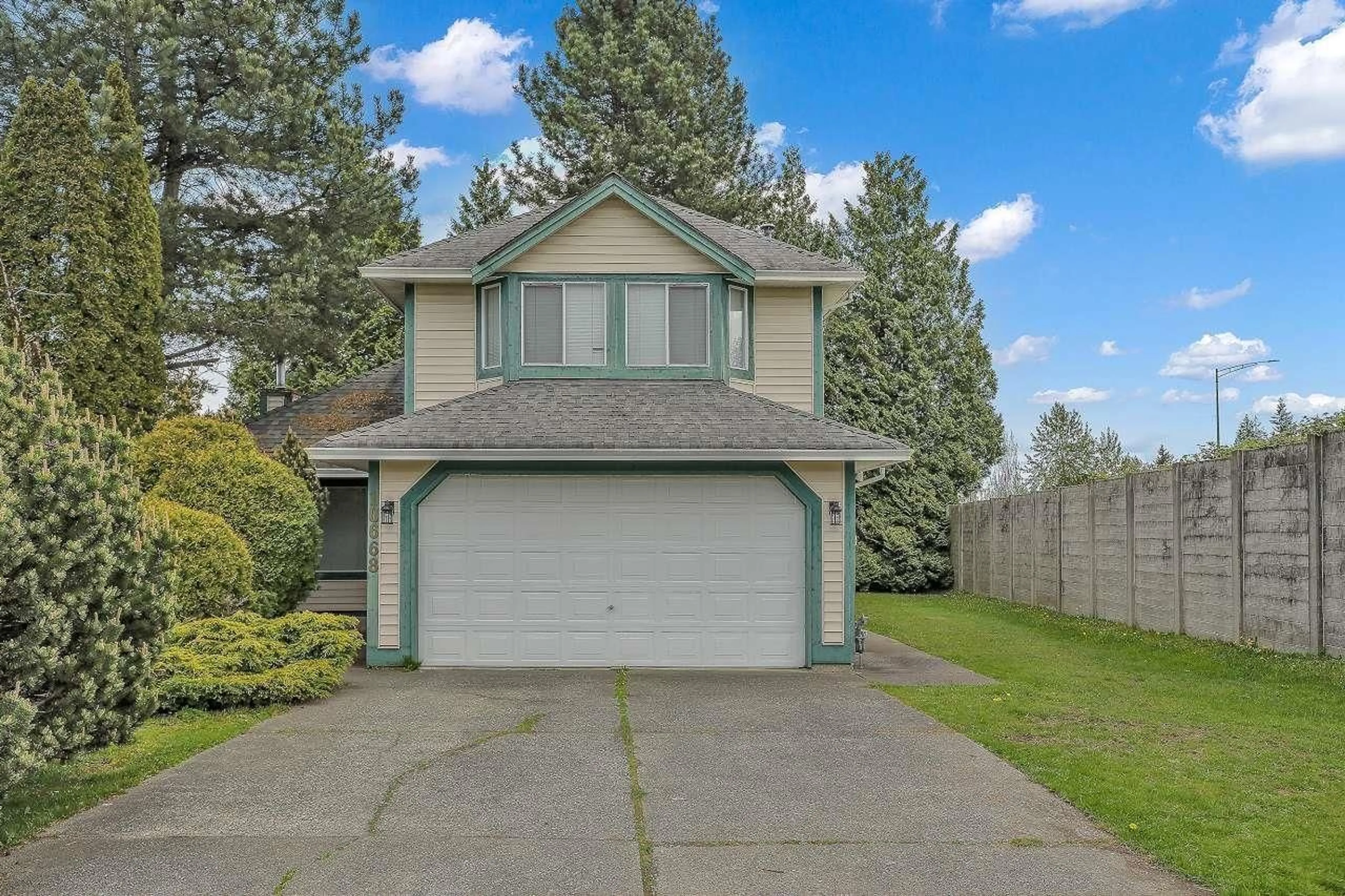 Home with vinyl exterior material, street for 10668 155A, Surrey British Columbia V3R9X5