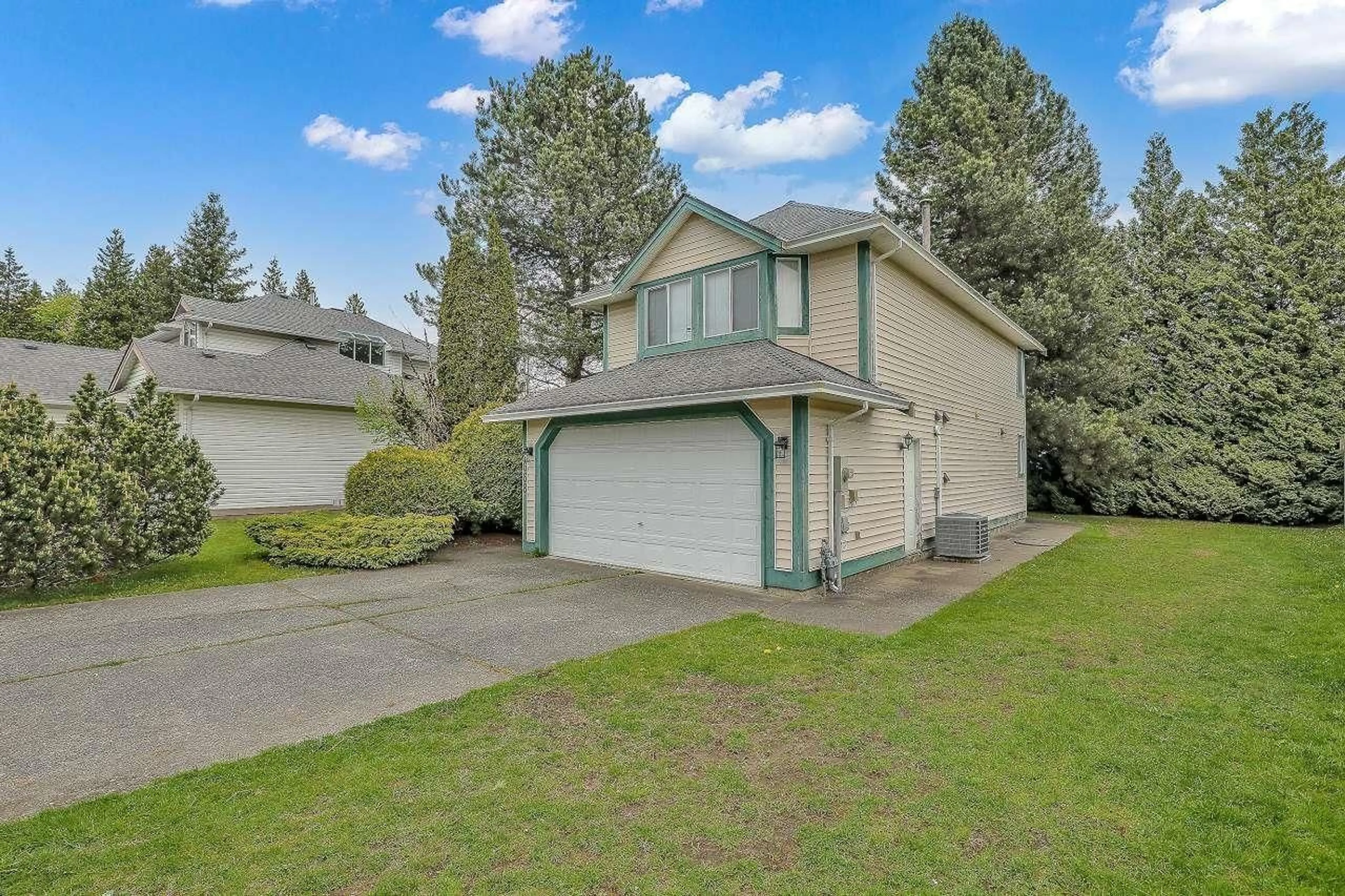 Home with vinyl exterior material, street for 10668 155A, Surrey British Columbia V3R9X5