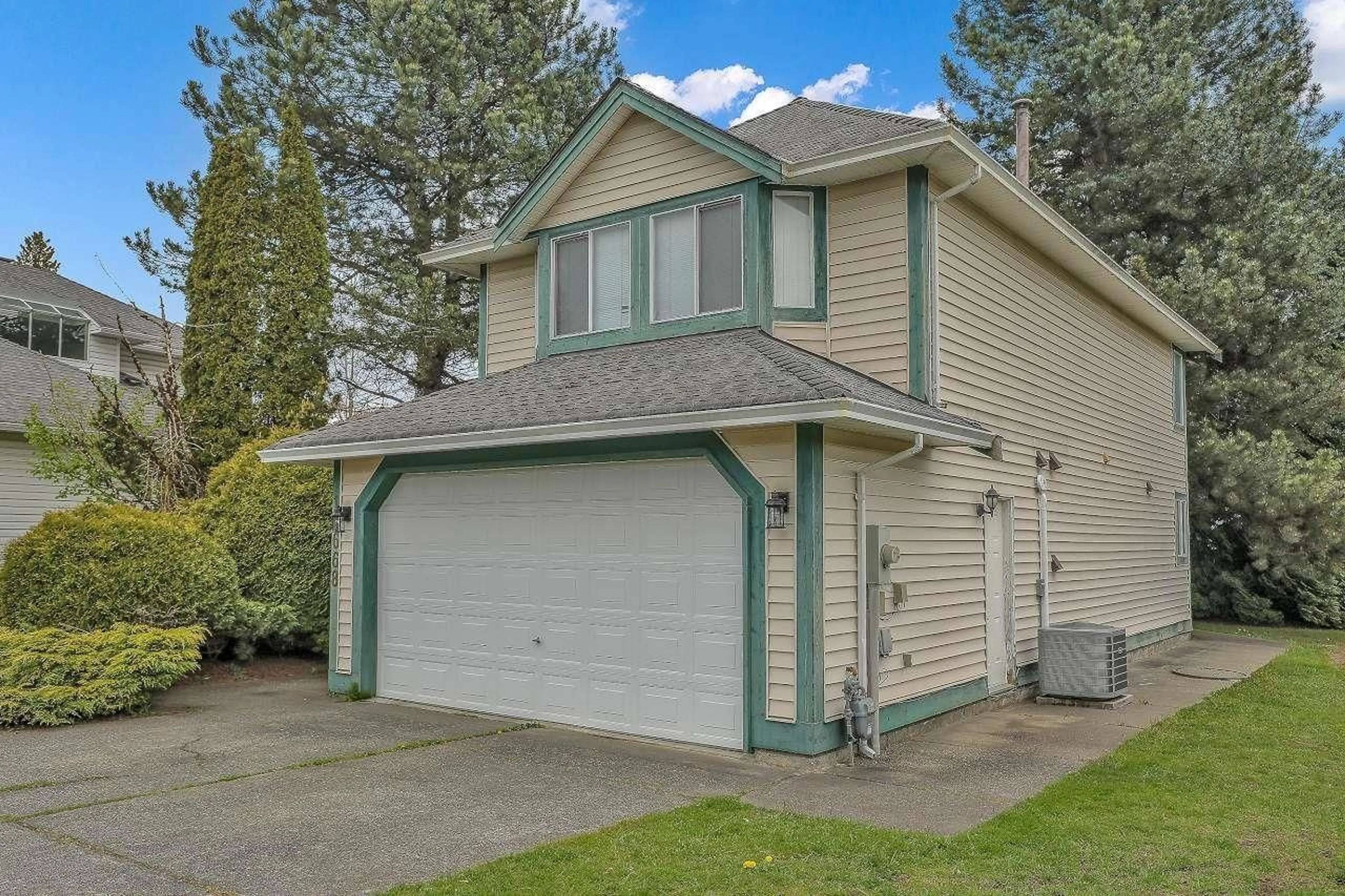 Home with vinyl exterior material, street for 10668 155A, Surrey British Columbia V3R9X5
