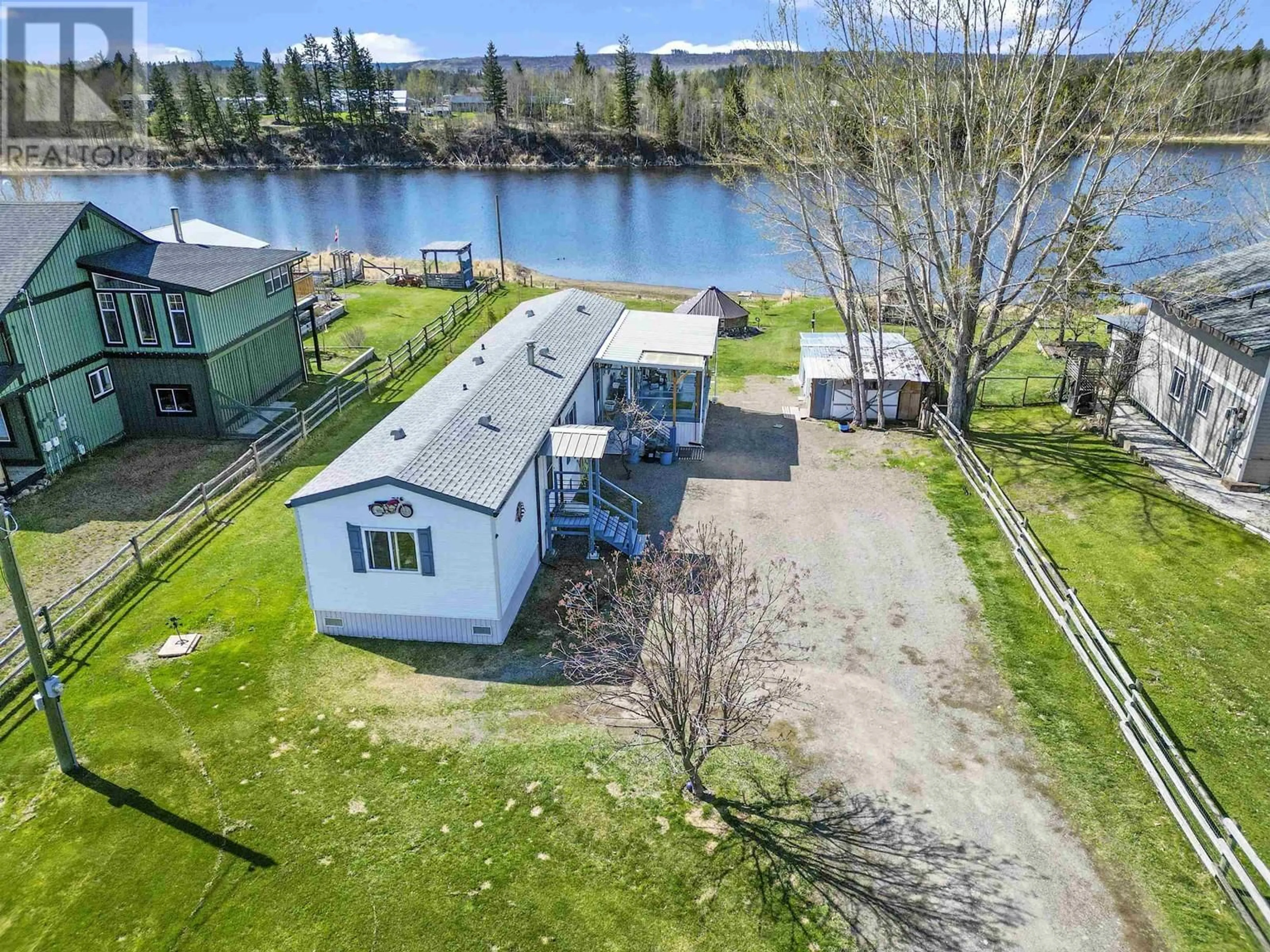 A pic from outside/outdoor area/front of a property/back of a property/a pic from drone, water/lake/river/ocean view for 5480 TATTON STATION ROAD, 100 Mile House British Columbia V0K2E1