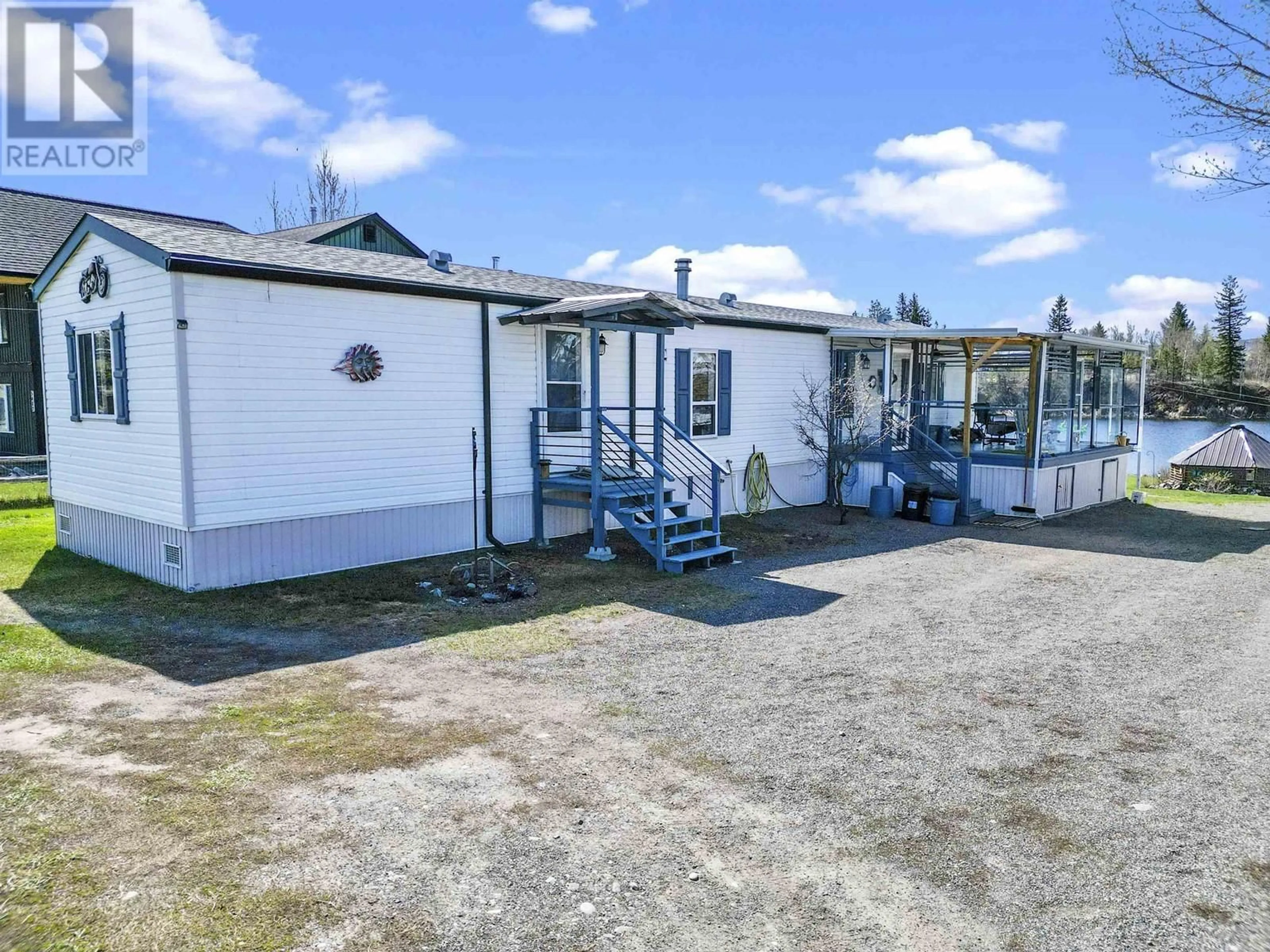 A pic from outside/outdoor area/front of a property/back of a property/a pic from drone, street for 5480 TATTON STATION ROAD, 100 Mile House British Columbia V0K2E1