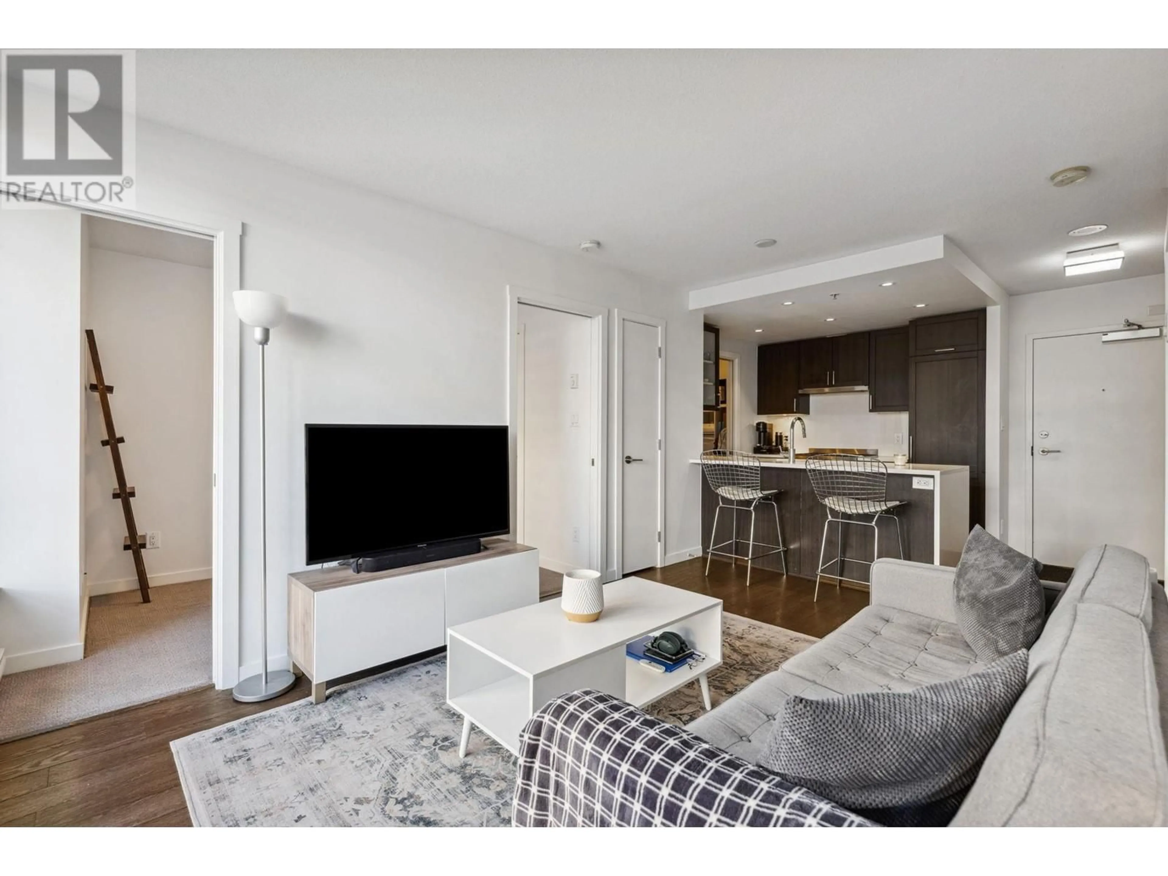 Living room with furniture, wood/laminate floor for 514 - 5665 BOUNDARY ROAD, Vancouver British Columbia V5R0E4