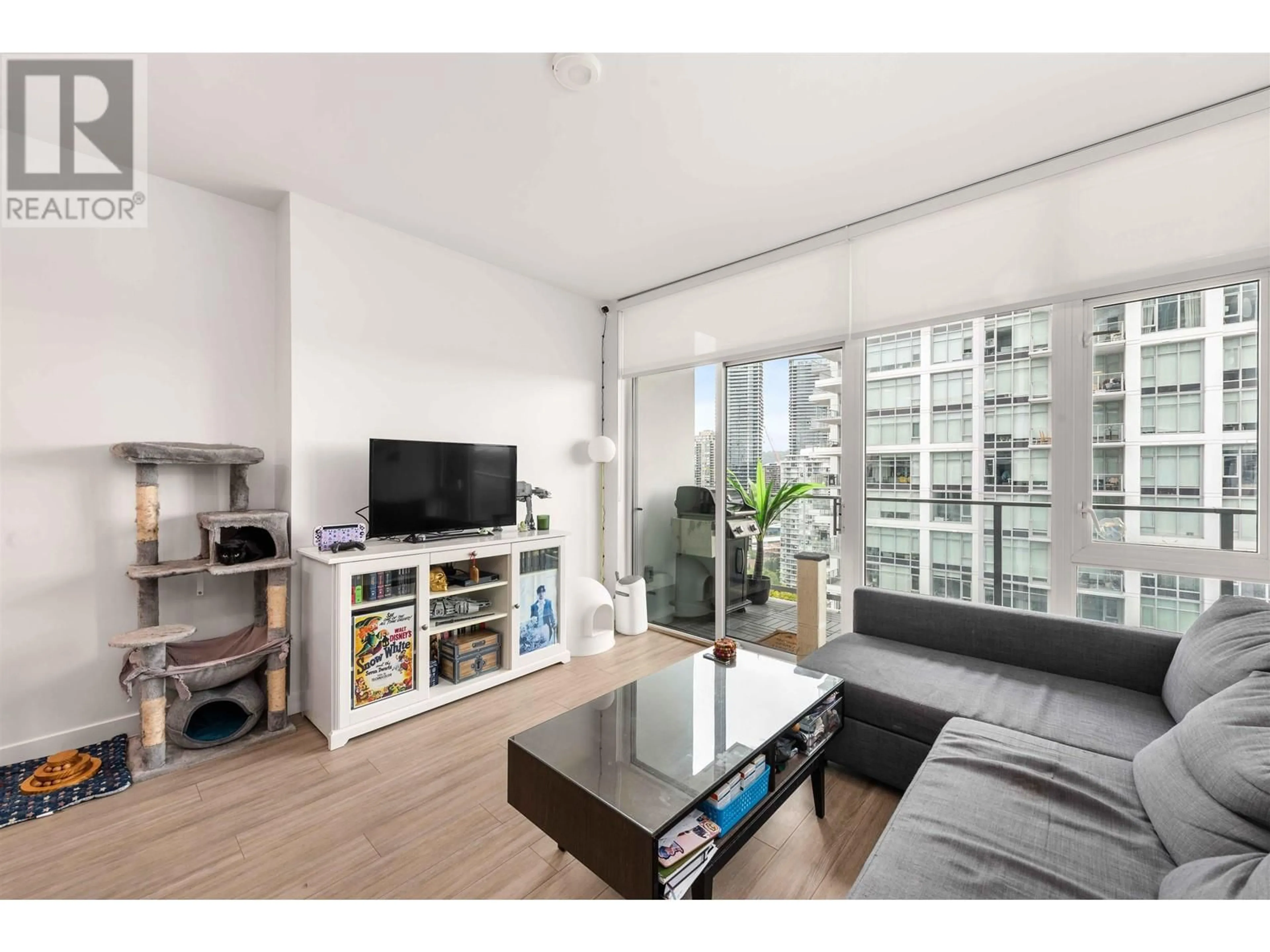 Living room with furniture, wood/laminate floor for 2104 - 2311 BETA AVENUE, Burnaby British Columbia V5C0M1