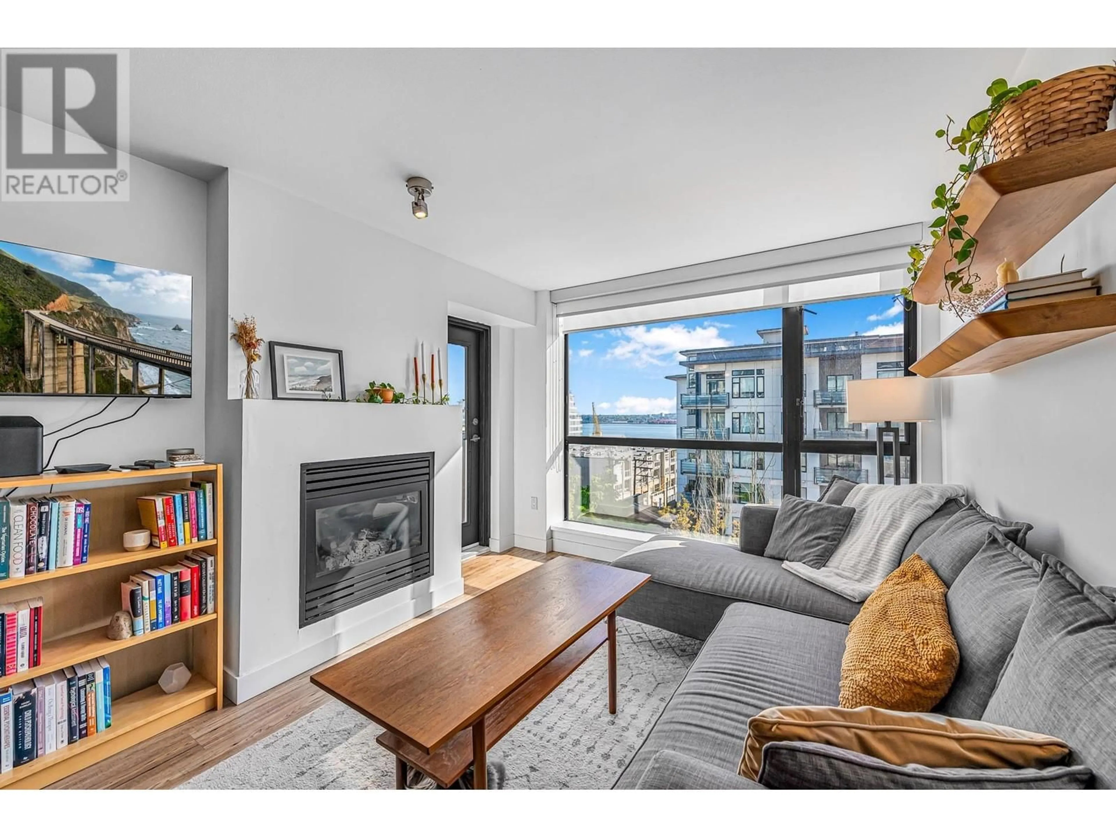 Living room with furniture, wood/laminate floor for 503 - 124 1ST STREET, North Vancouver British Columbia V7M3N3
