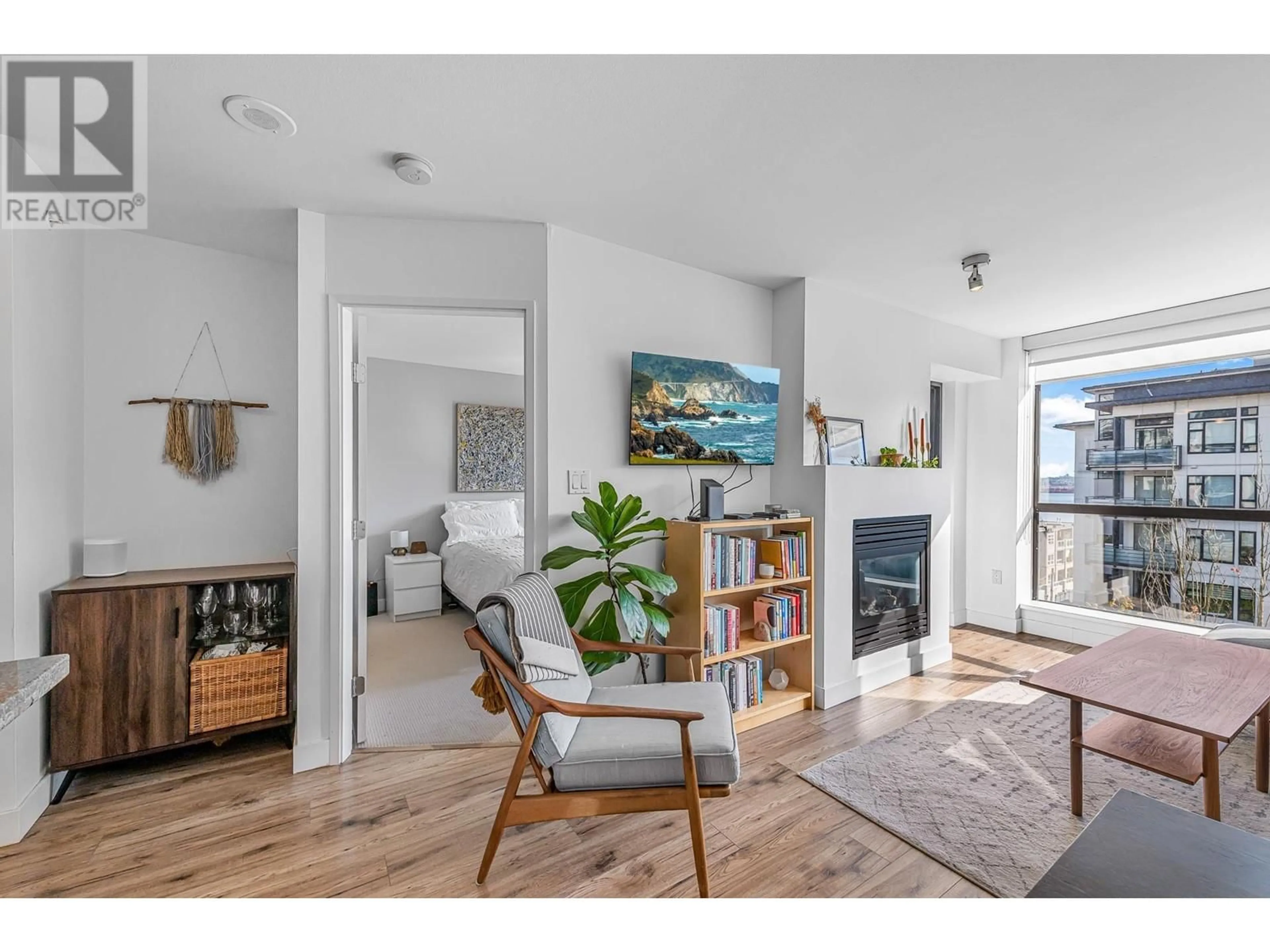 Living room with furniture, wood/laminate floor for 503 - 124 1ST STREET, North Vancouver British Columbia V7M3N3