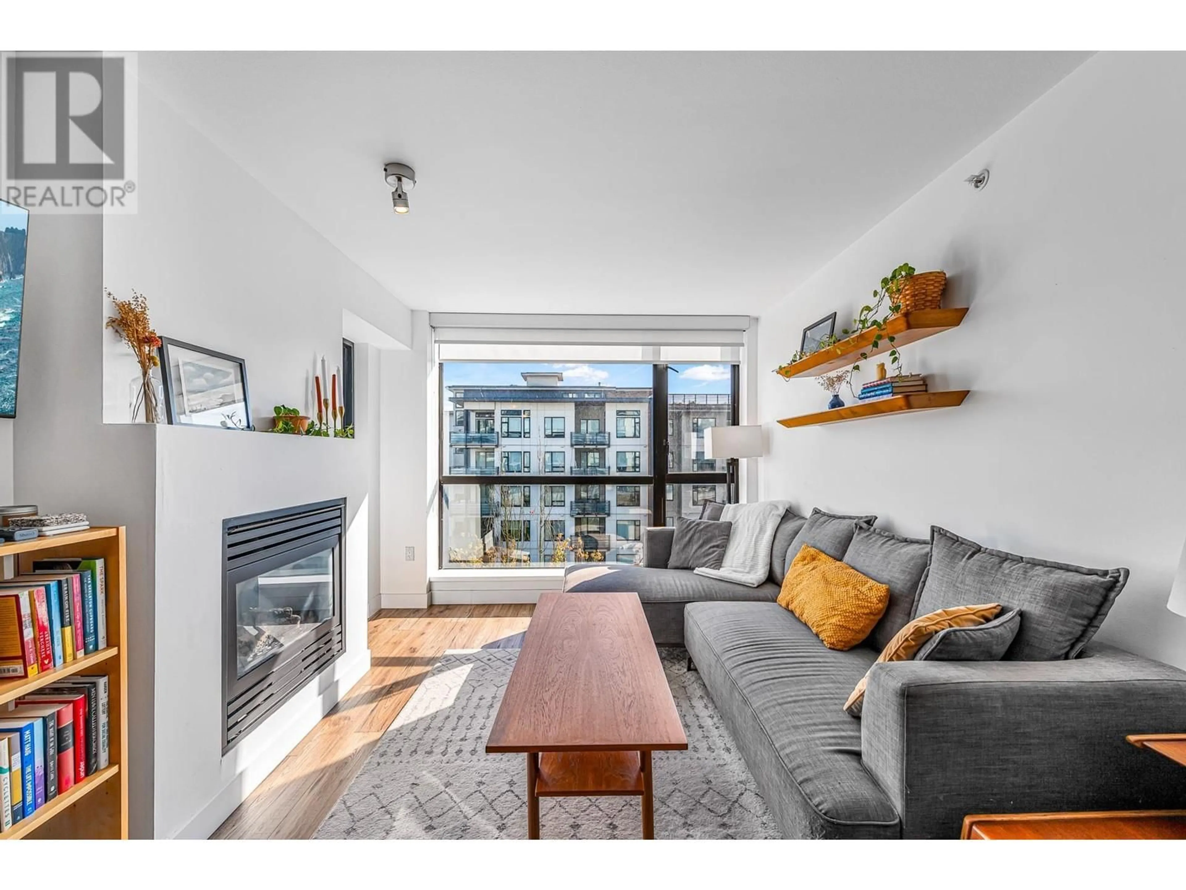 Living room with furniture, wood/laminate floor for 503 - 124 1ST STREET, North Vancouver British Columbia V7M3N3