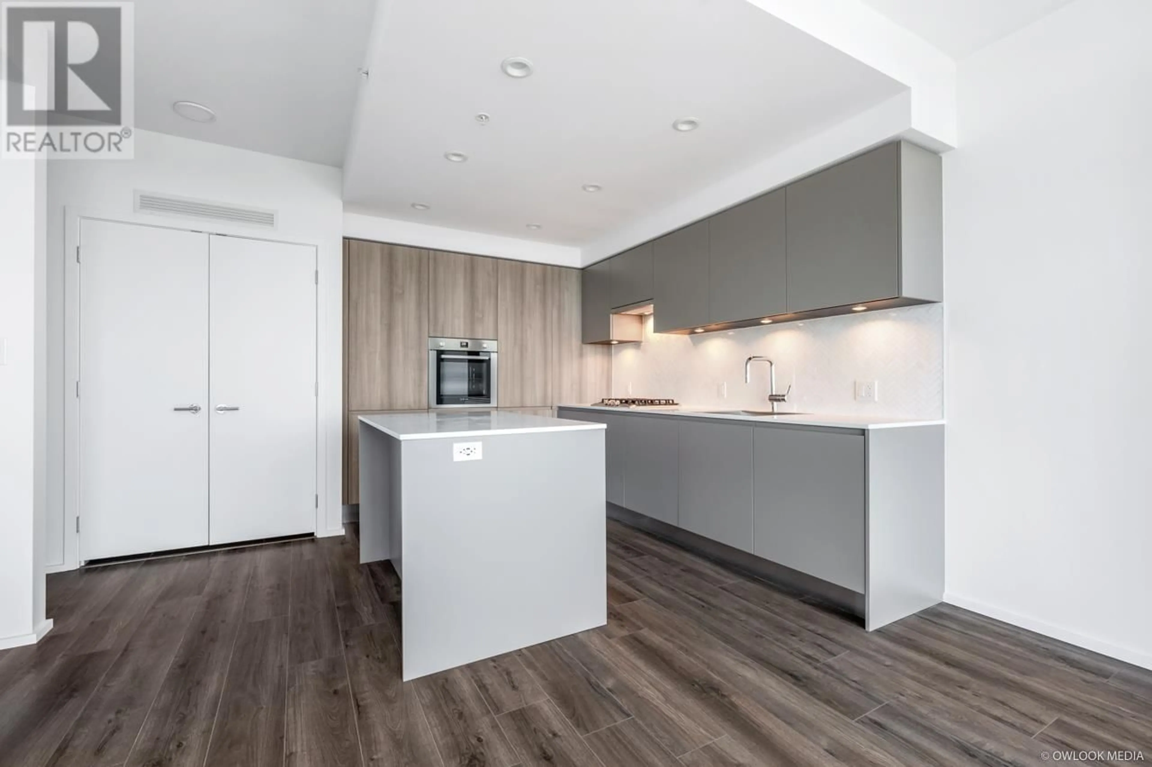 Open concept kitchen, wood/laminate floor for 3902 - 3809 EVERGREEN PLACE, Burnaby British Columbia V3J0M1