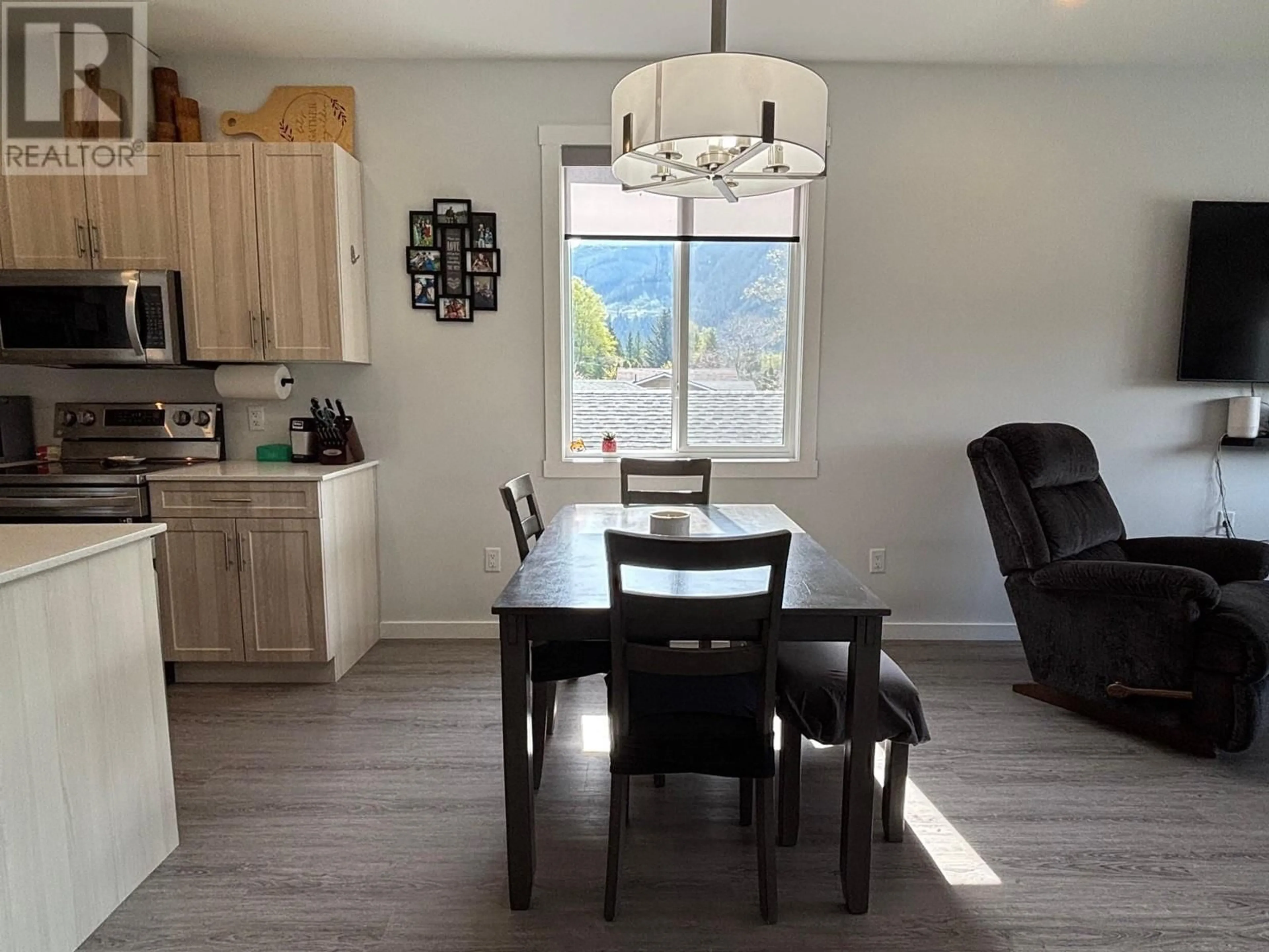 Open concept kitchen, wood/laminate floor for 4654 COPPER RIVER ROAD, Terrace British Columbia V8G0A5