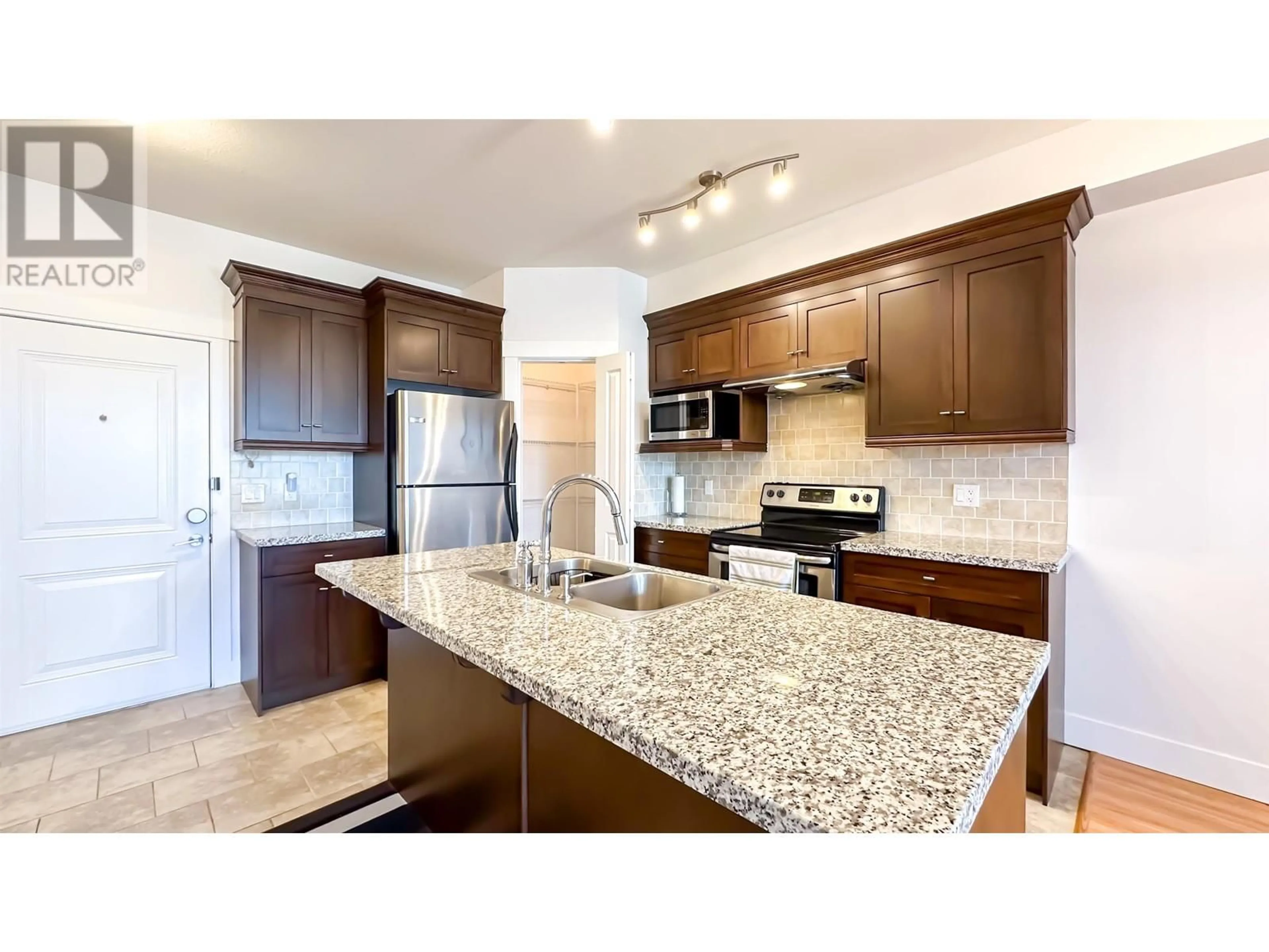 Open concept kitchen, ceramic/tile floor for 205 - 7908 GRAHAM AVENUE, Burnaby British Columbia V3N1V9