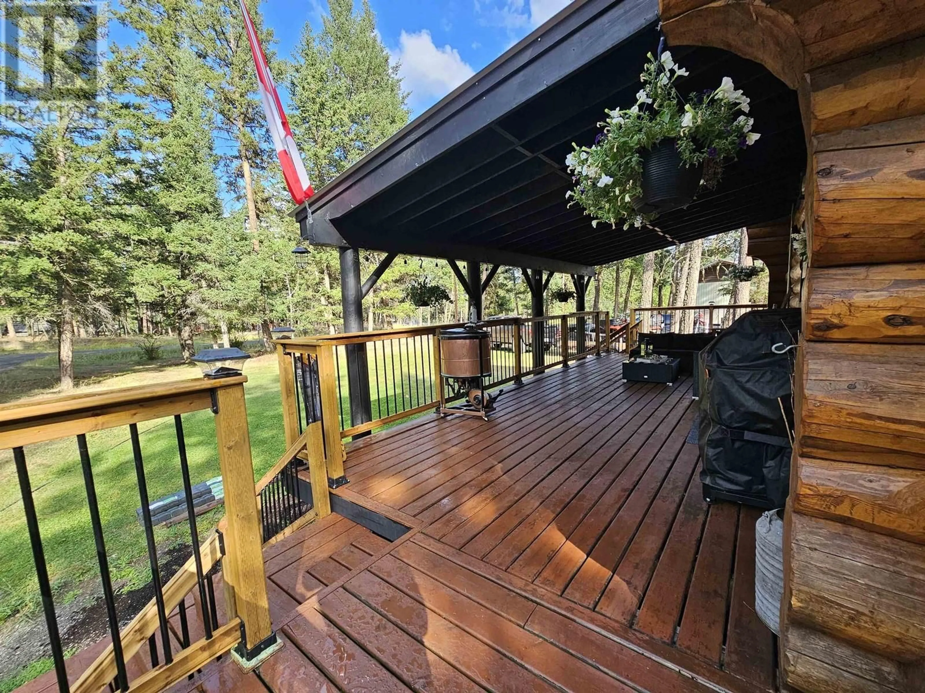 Patio, water/lake/river/ocean view for 4884 KITWANGA DRIVE, 108 Mile Ranch British Columbia V0K2Z0